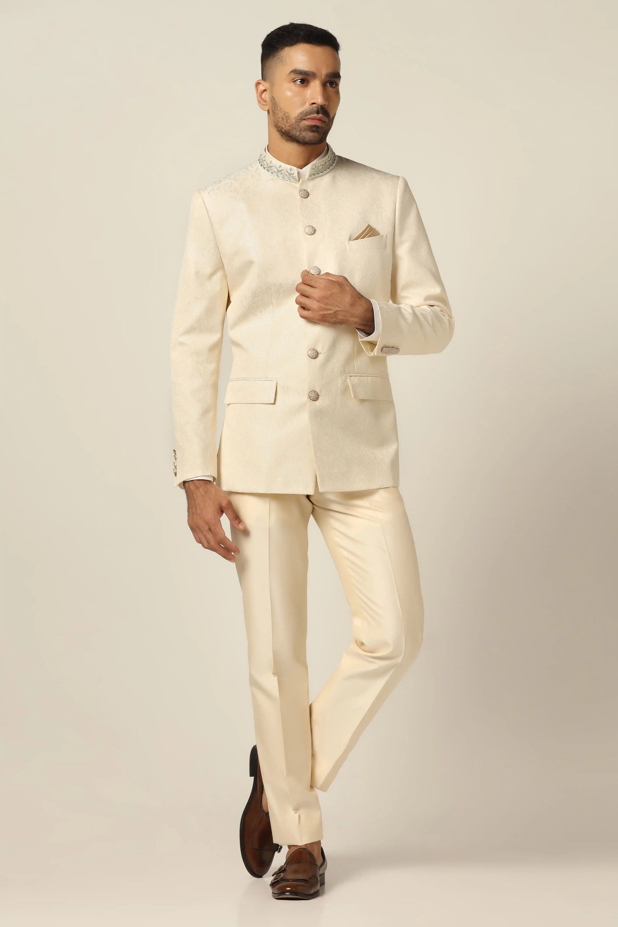 Unveil timeless elegance with a white bandhgala suit, showcasing intricate embroidery work. Buy Now!