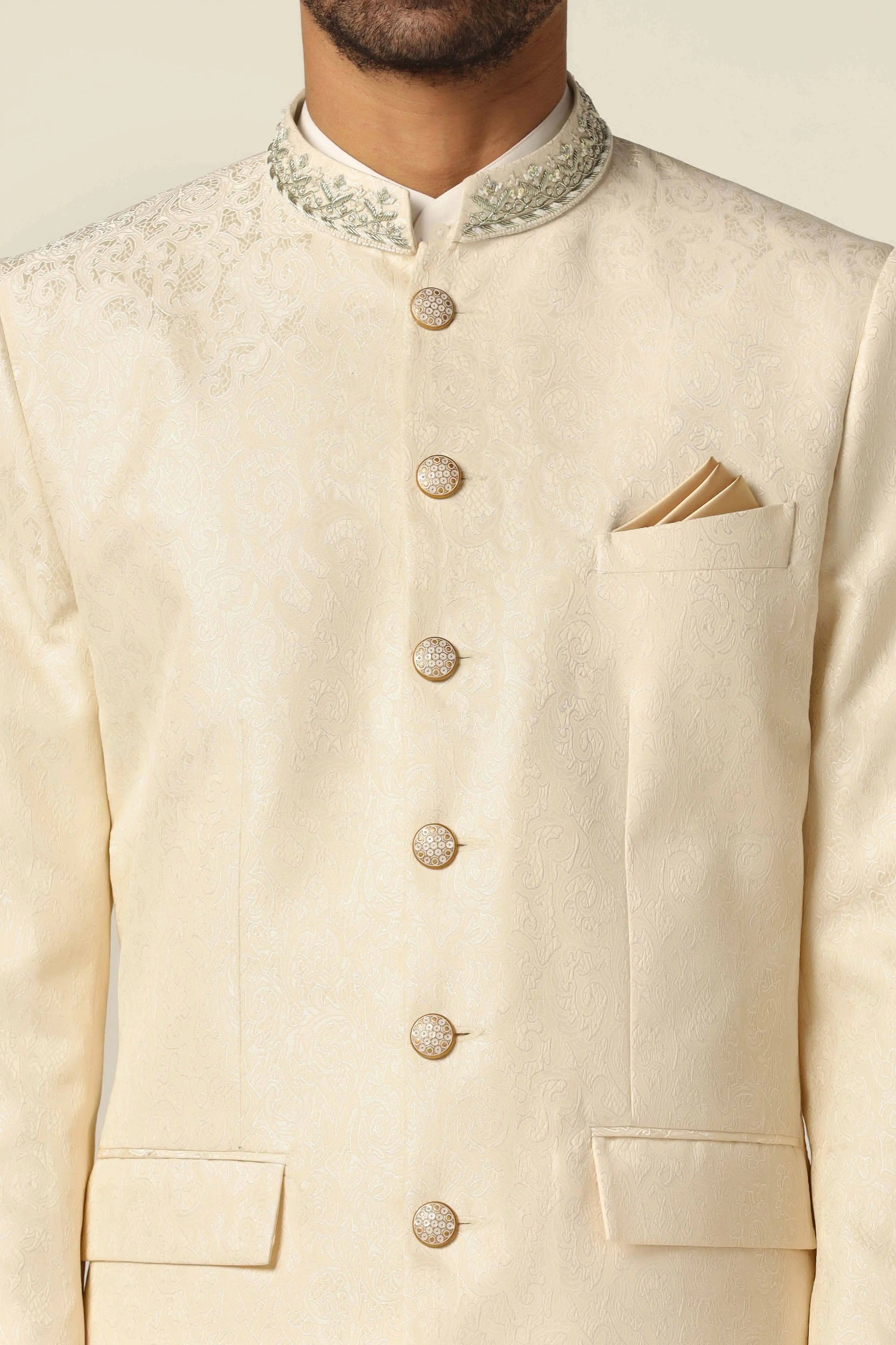 Unveil timeless elegance with a white bandhgala suit, showcasing intricate embroidery work. Buy Now!