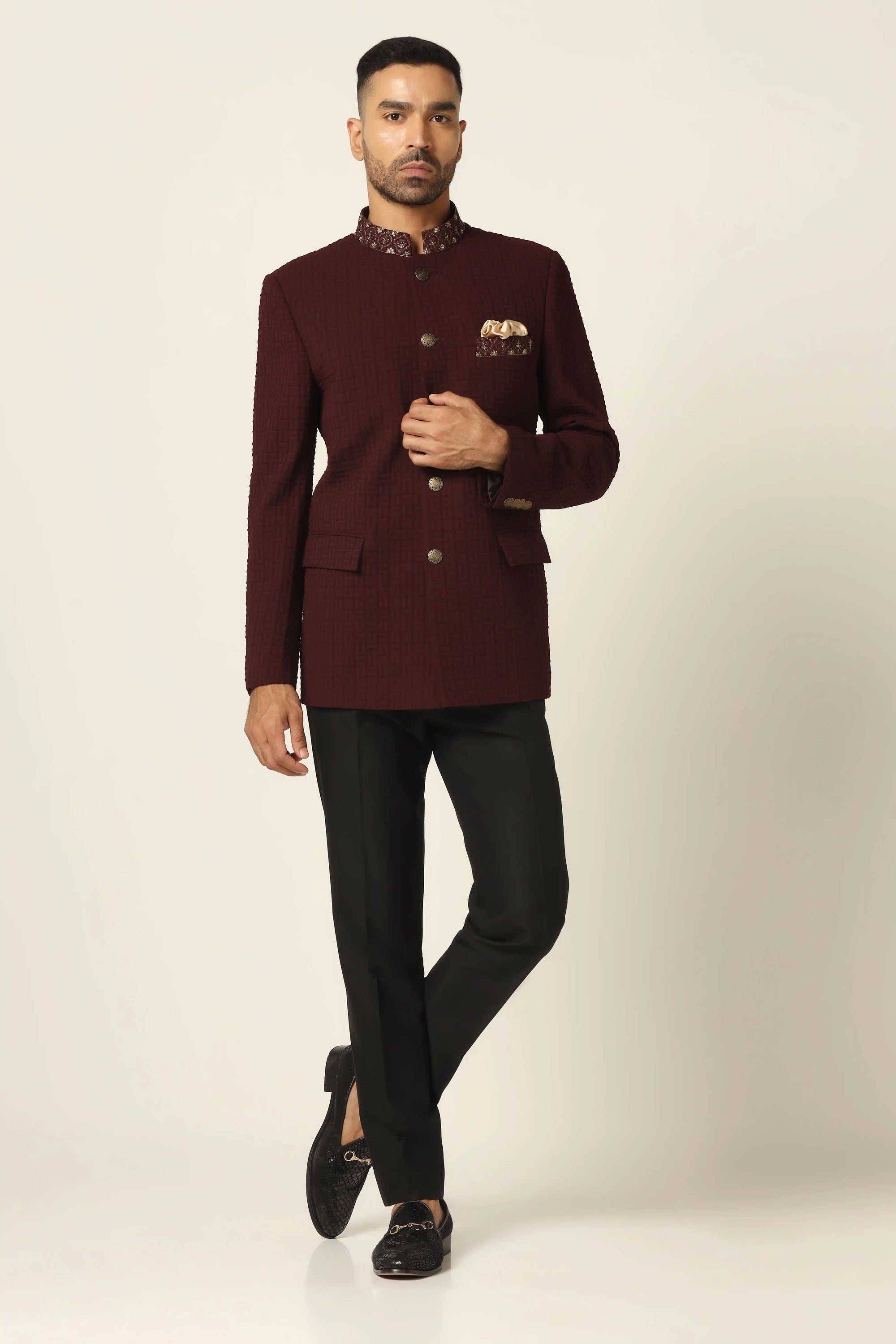 Discover luxury with a maroon textured bandhgala suit at Brahaan Store. Shop now!