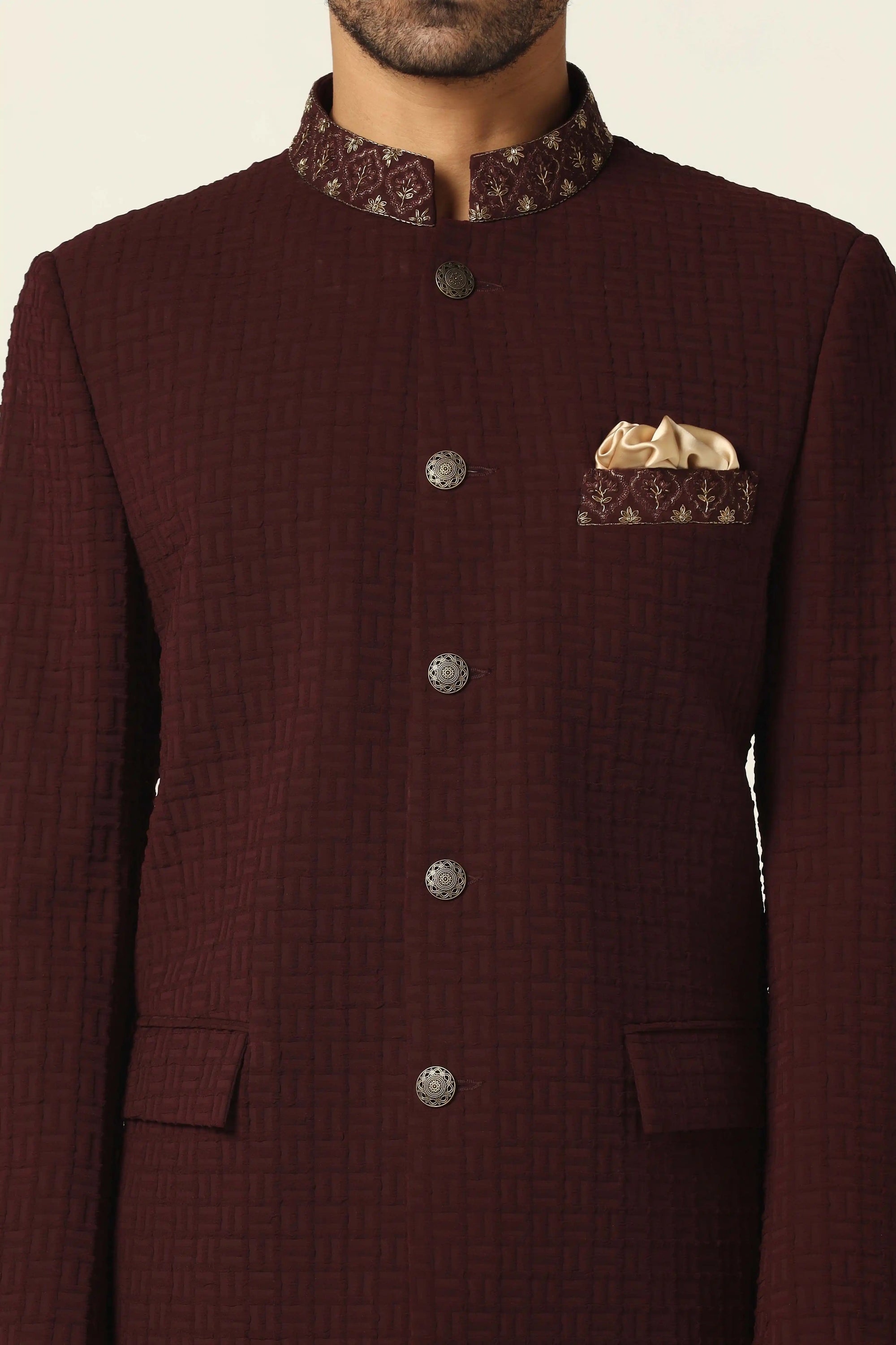 Discover luxury with a maroon textured bandhgala suit at Brahaan Store. Shop now!