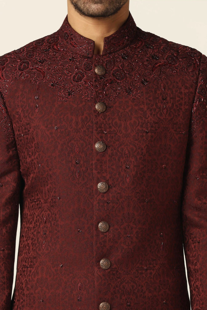 Indulge in elegance with this Maroon Indo set, adorned with intricate machine embroidery, paired flawlessly with jet-black trousers.
