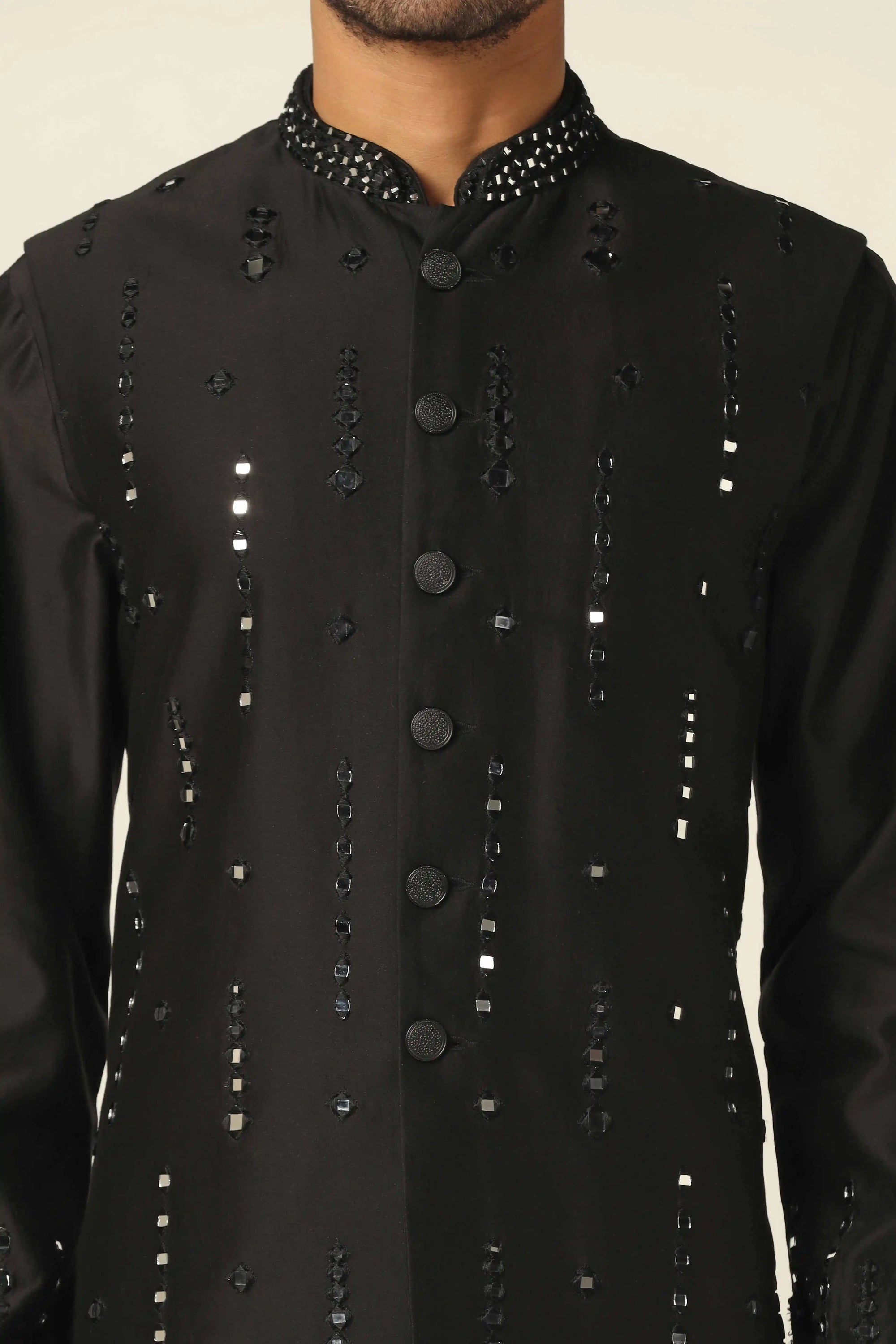 Add glamour to your wardrobe with the Black Nehru Set featuring mirror embroidery. Shop now!