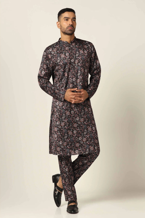 Elegance meets tradition in our soft printed silk set. The kurta, with its classic cut, is paired with comfortable trouser pajamas for timeless style.