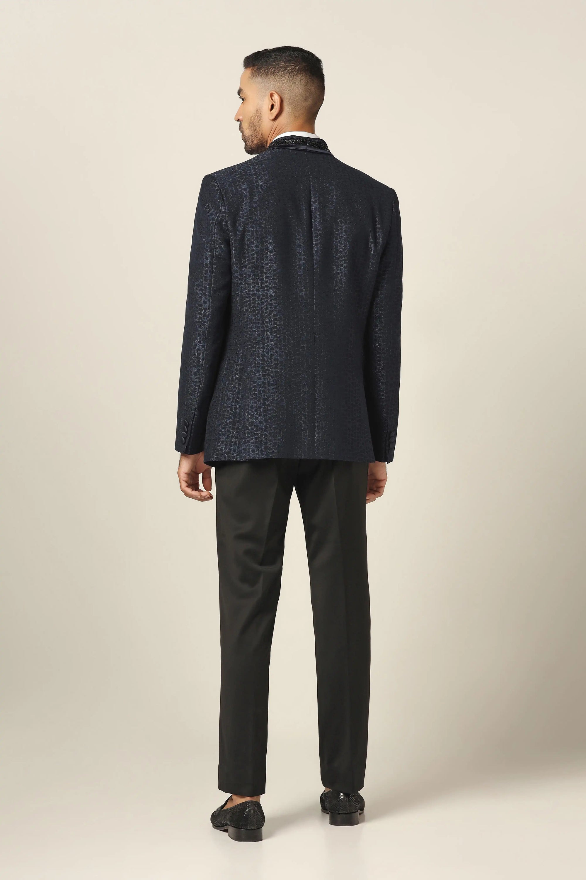 Experience the elegance of the Navy Tuxedo with stunning embroidery. Shop Now!
