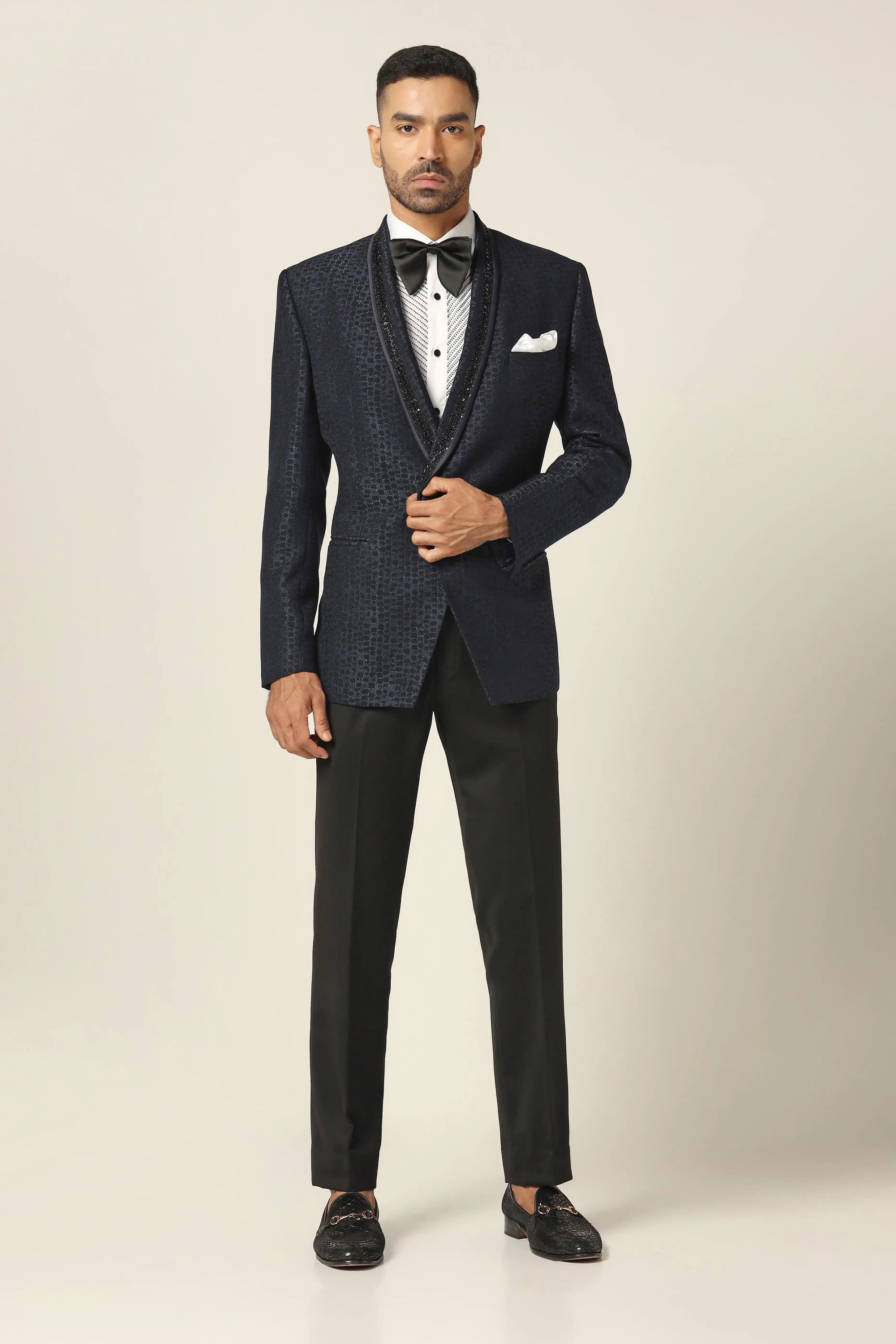 Experience the elegance of the Navy Tuxedo with stunning embroidery. Shop Now!
