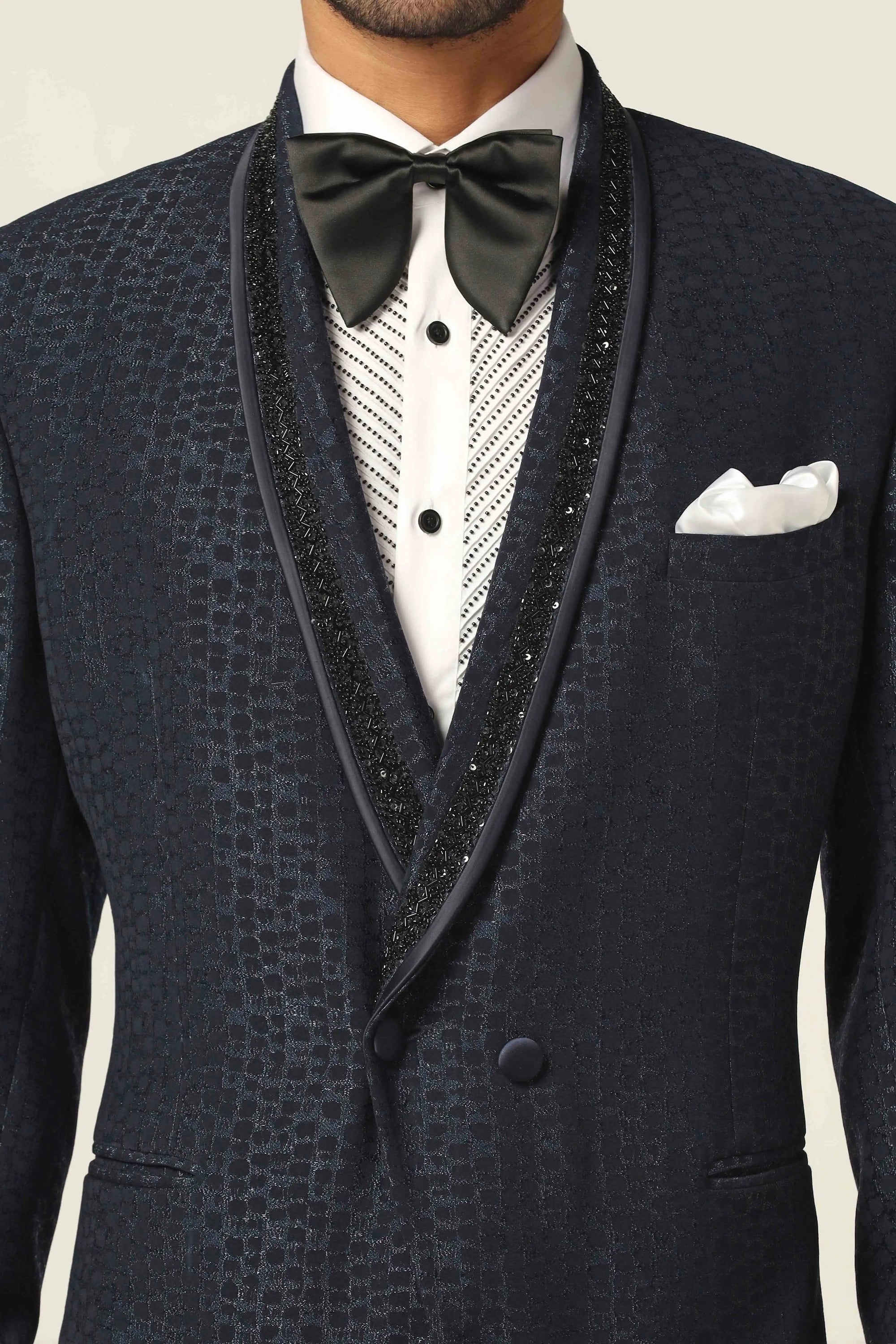 Experience the elegance of the Navy Tuxedo with stunning embroidery. Shop Now!
