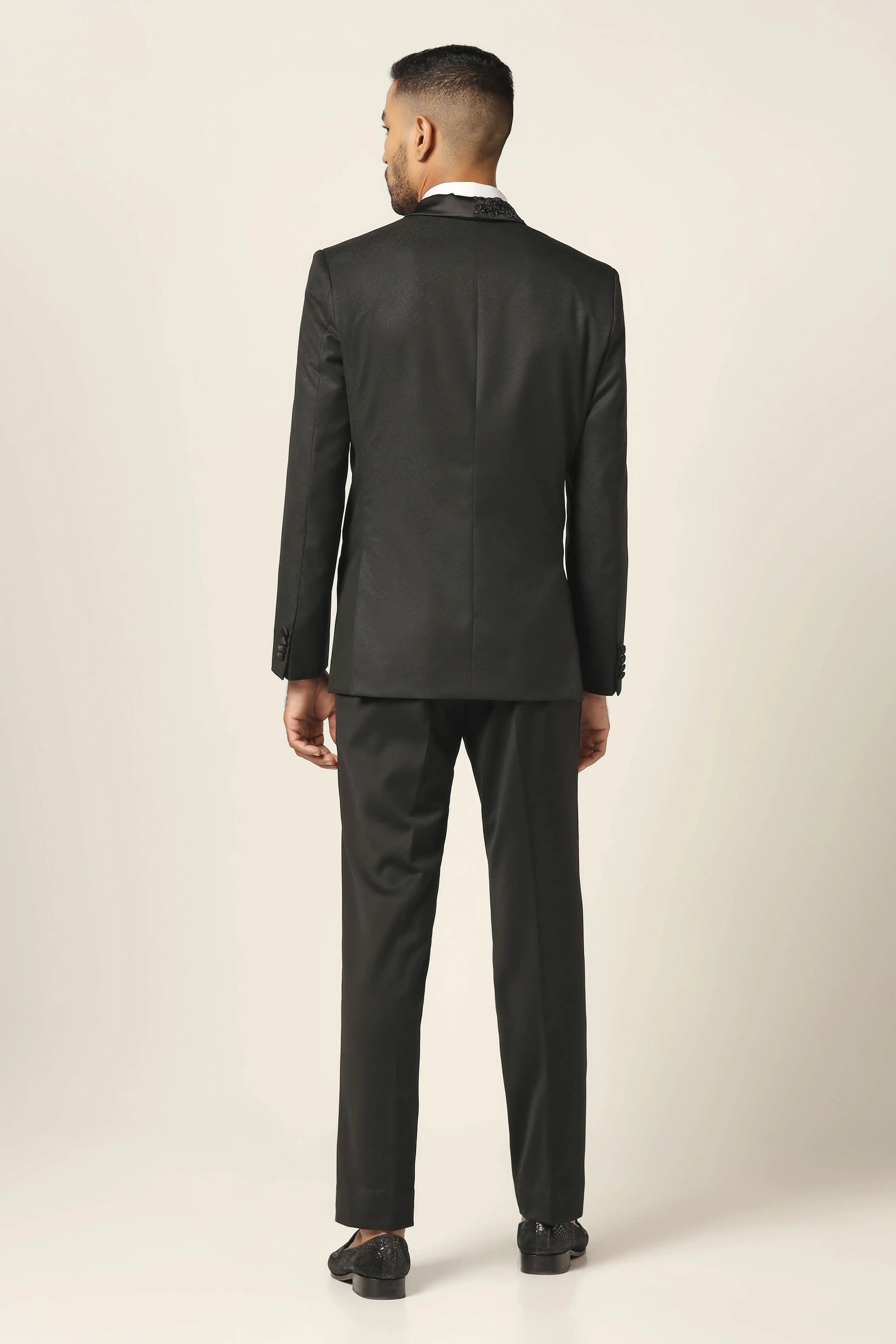 A navy tuxedo with exquisite embroidery to make every occasion special. Shop Now!