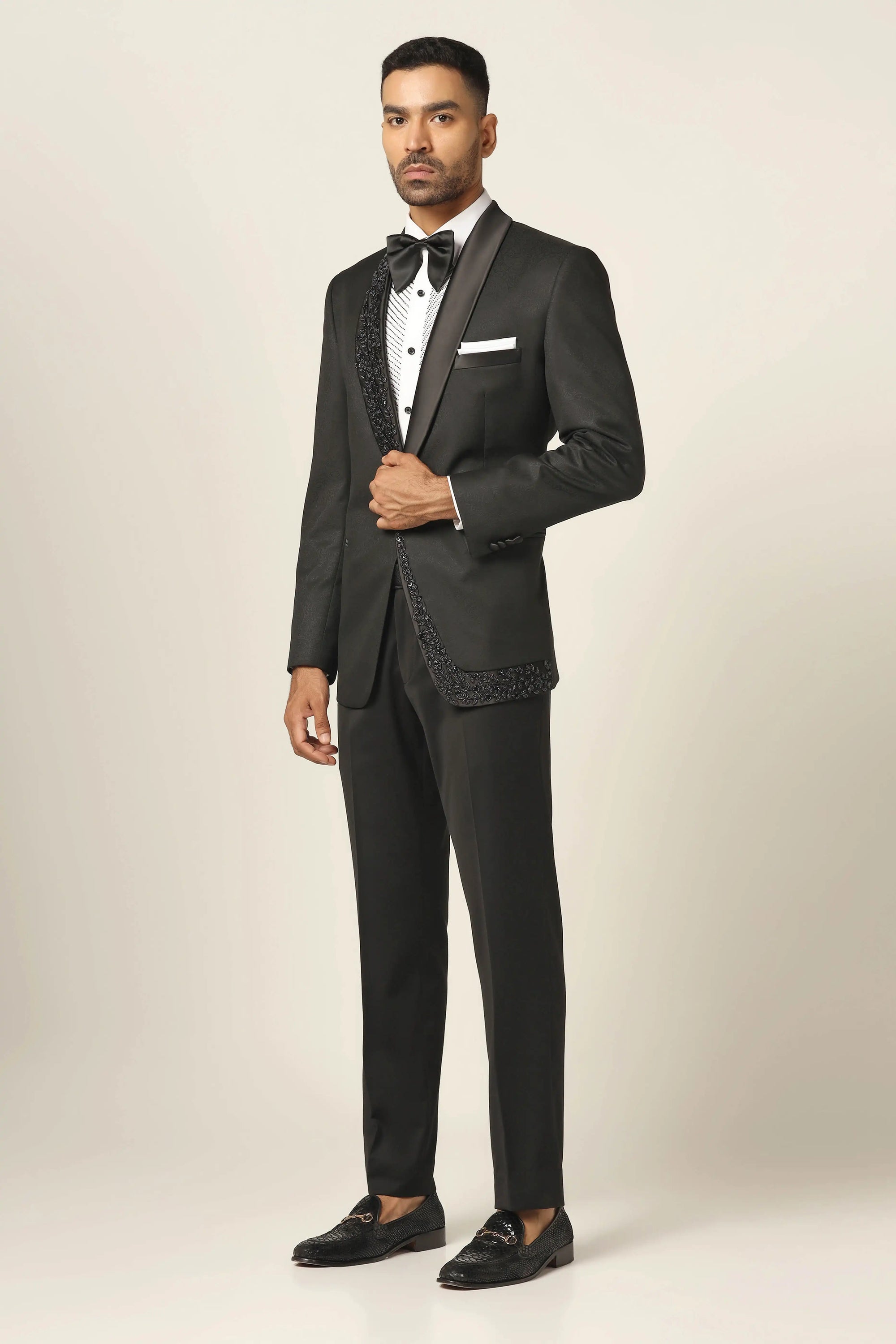 A navy tuxedo with exquisite embroidery to make every occasion special. Shop Now!