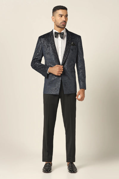 Elevate your style with our Navy Tuxedo. Shawl collar, vibrant floral embroidery. Complete with matched Trouser. Shirts and bows sold separately.