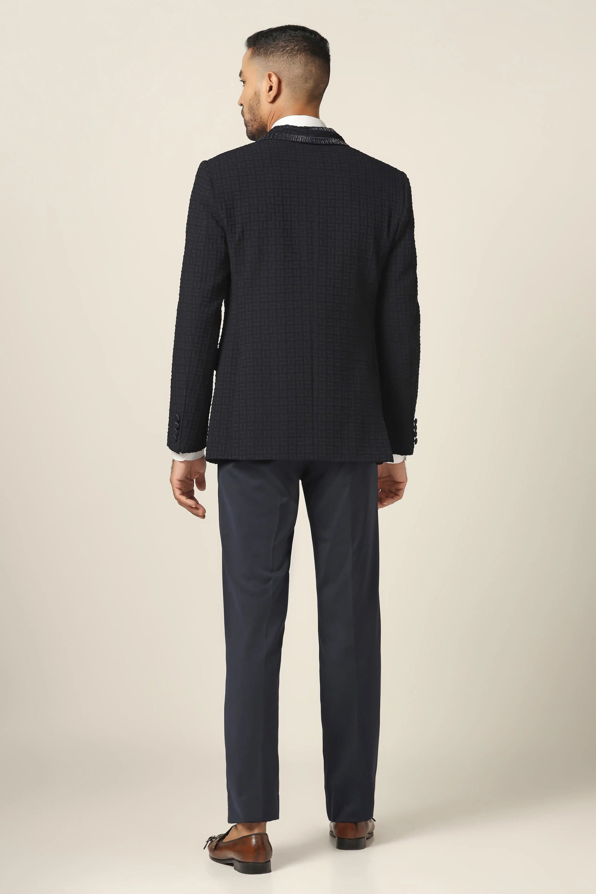 Make a statement with the Navy Textured Tuxedo Suit. Shop Now!