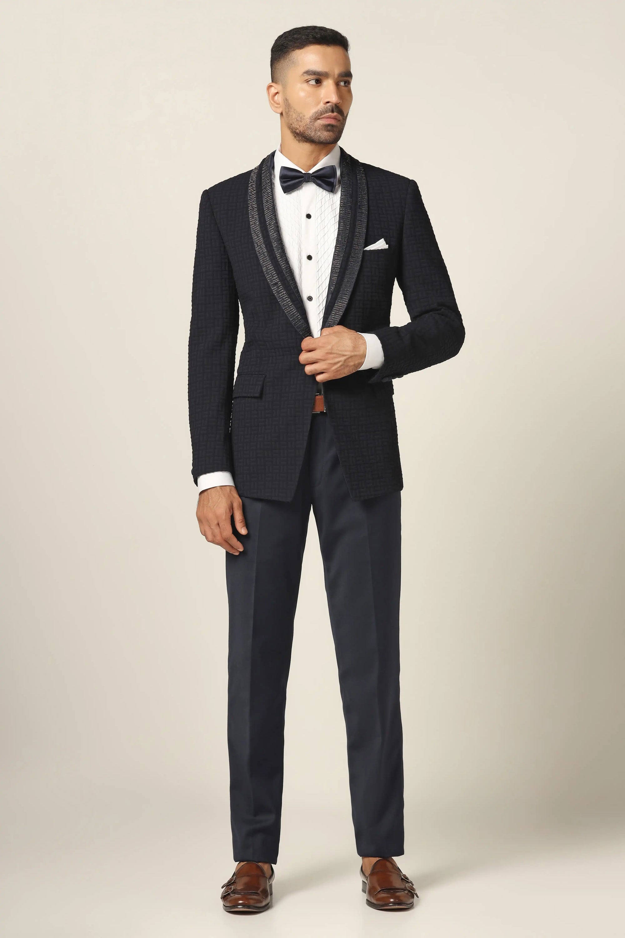 Make a statement with the Navy Textured Tuxedo Suit. Shop Now!