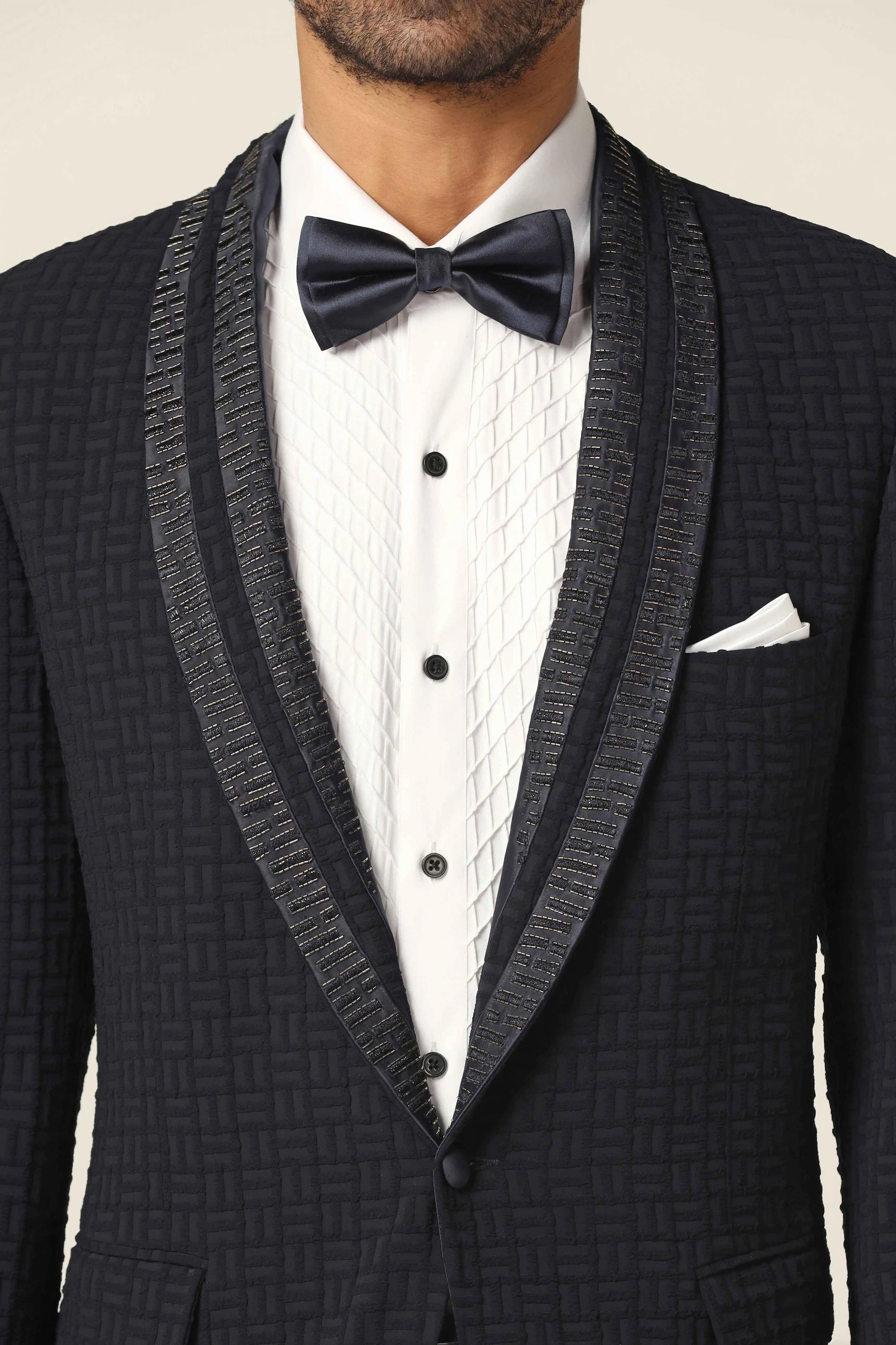 Make a statement with the Navy Textured Tuxedo Suit. Shop Now!