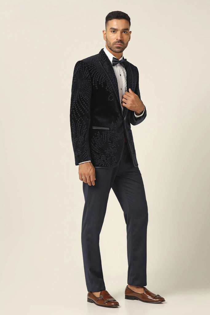 Elevate your style with our Cotton Velvet Tuxedo. Shawl collar, floral embroidery accentuates the coat. Jet black Trouser completes the ensemble.