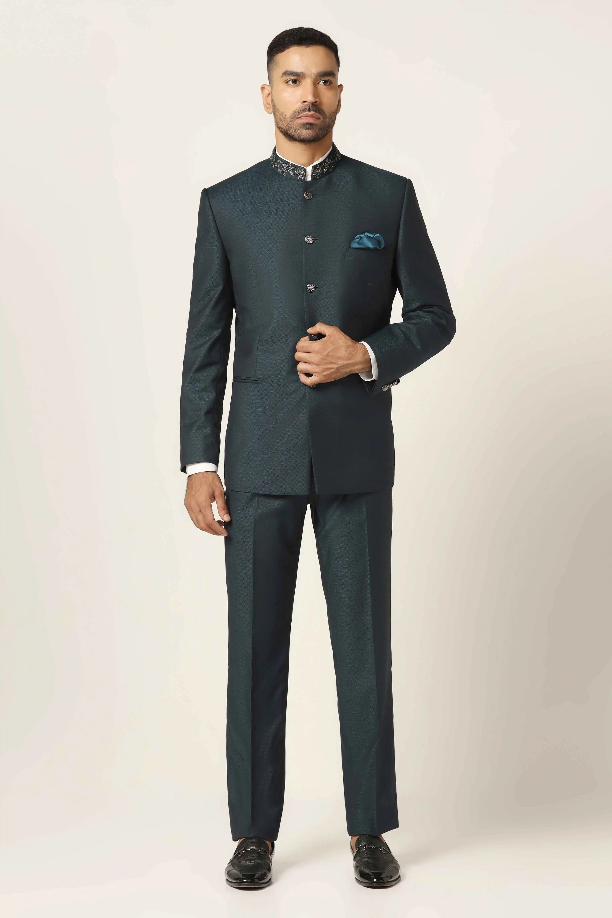 Add sophistication to your collection with a green textured bandhgala suit. Shop now!