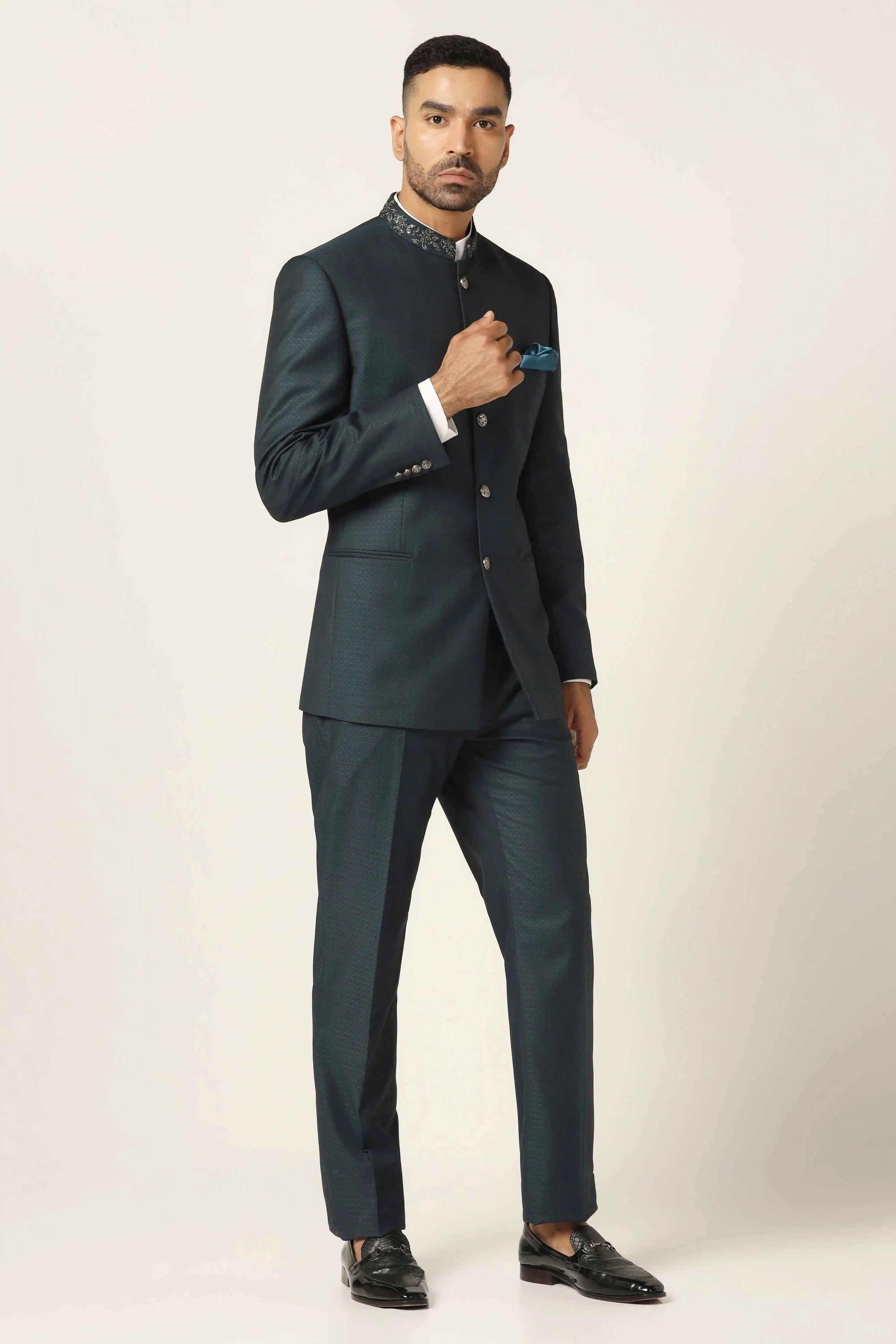 Add sophistication to your collection with a green textured bandhgala suit. Shop now!