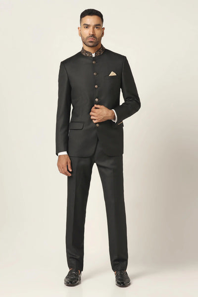 Enhance your look with our Bandhgala suit, showcasing hand embroidery on the collar. Paired with matching trousers for a sophisticated ensemble.
