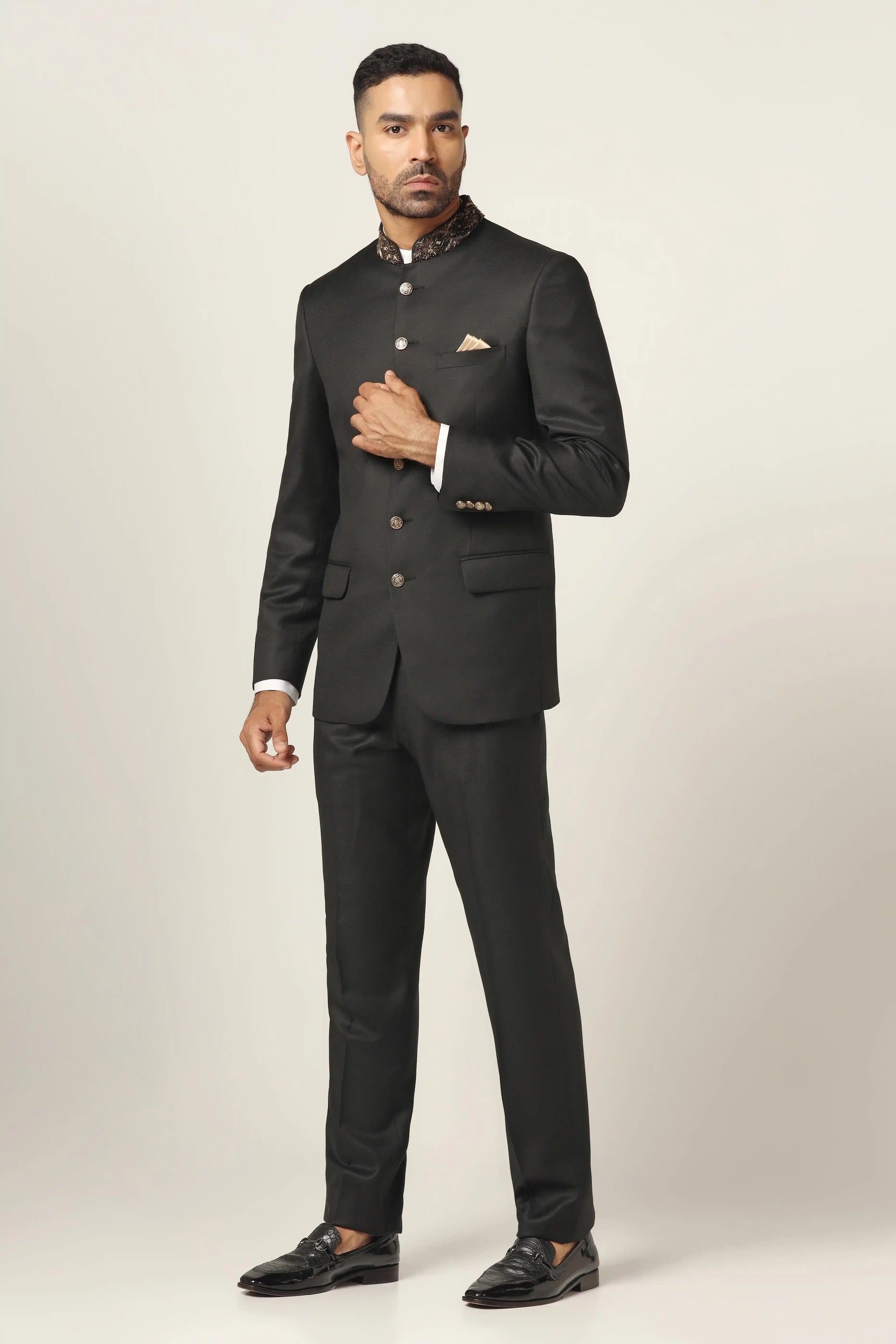 Add refined charm with a black bandhgala suit, delicately embroidered for a rich look. Shop Now!