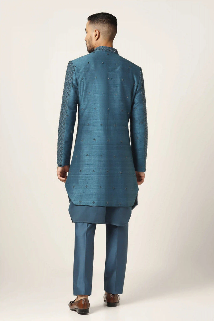 Dress in sophistication with our Indo-western set featuring tonal machine embroidery all over. Paired with a matching Kurta and pajama for a complete ensemble.