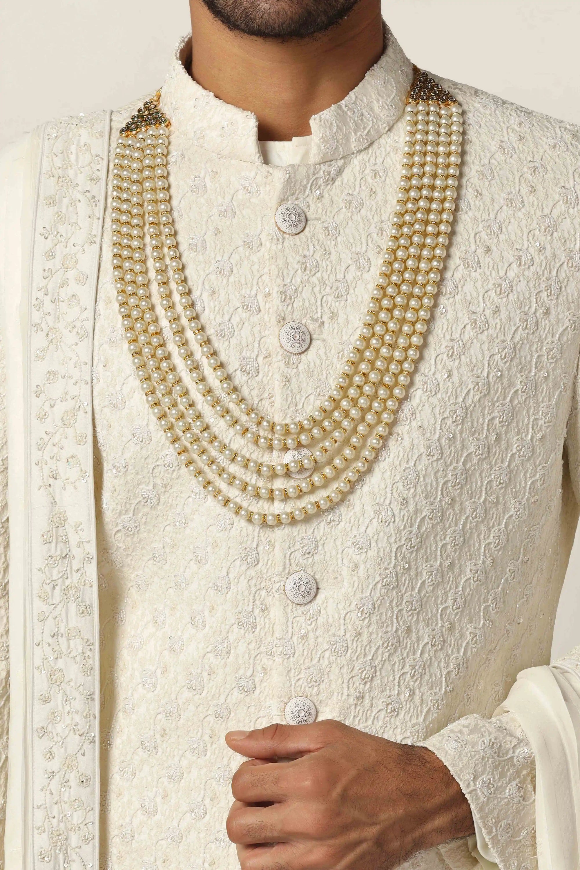 Drape in luxury with our Raw silk Sherwani set, intricately hand-embroidered throughout.  Shop Now!