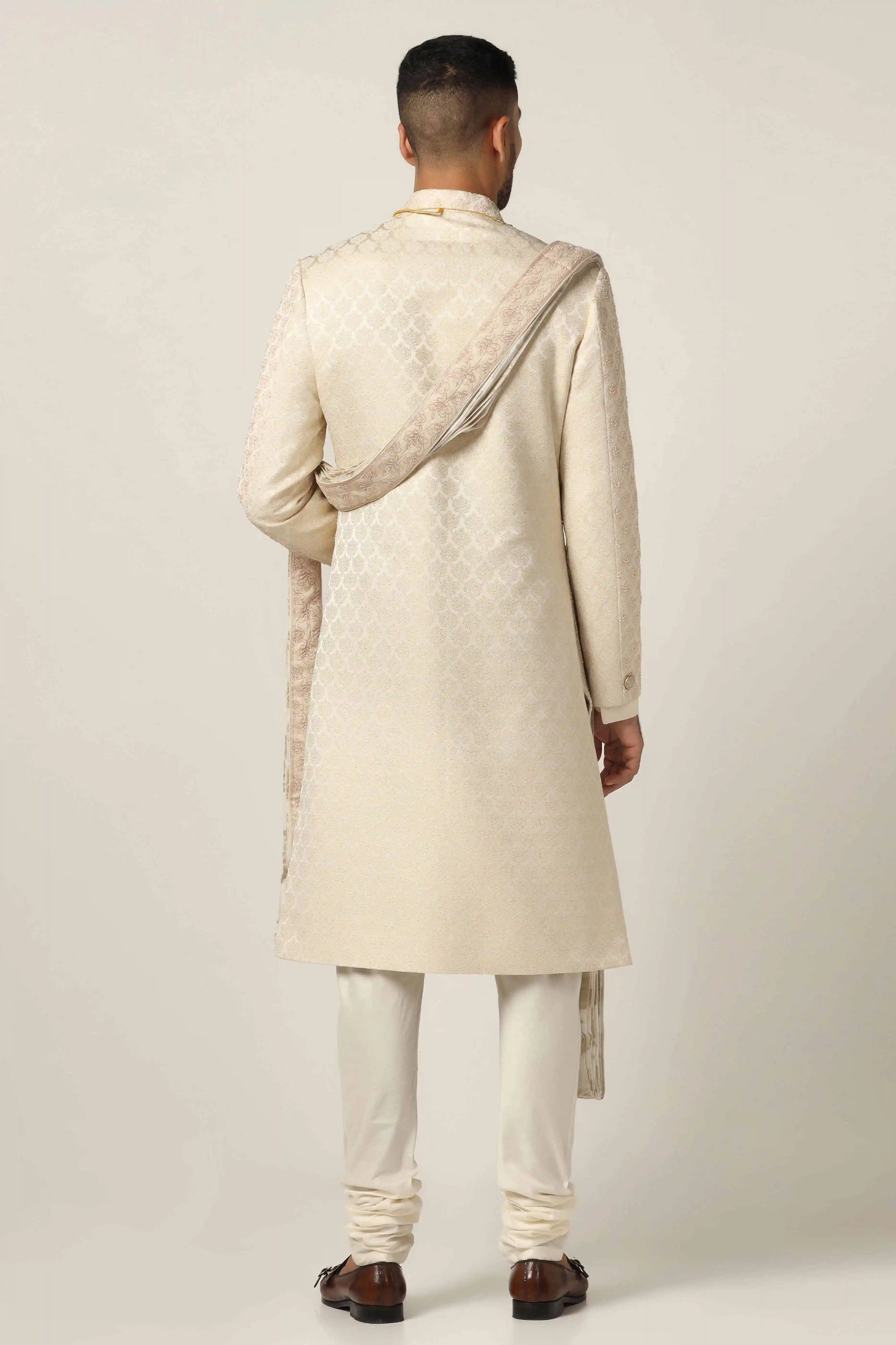 Elevate your style with Raw silk Sherwani set with intricate geometric pattern embroidery. Shop Now!