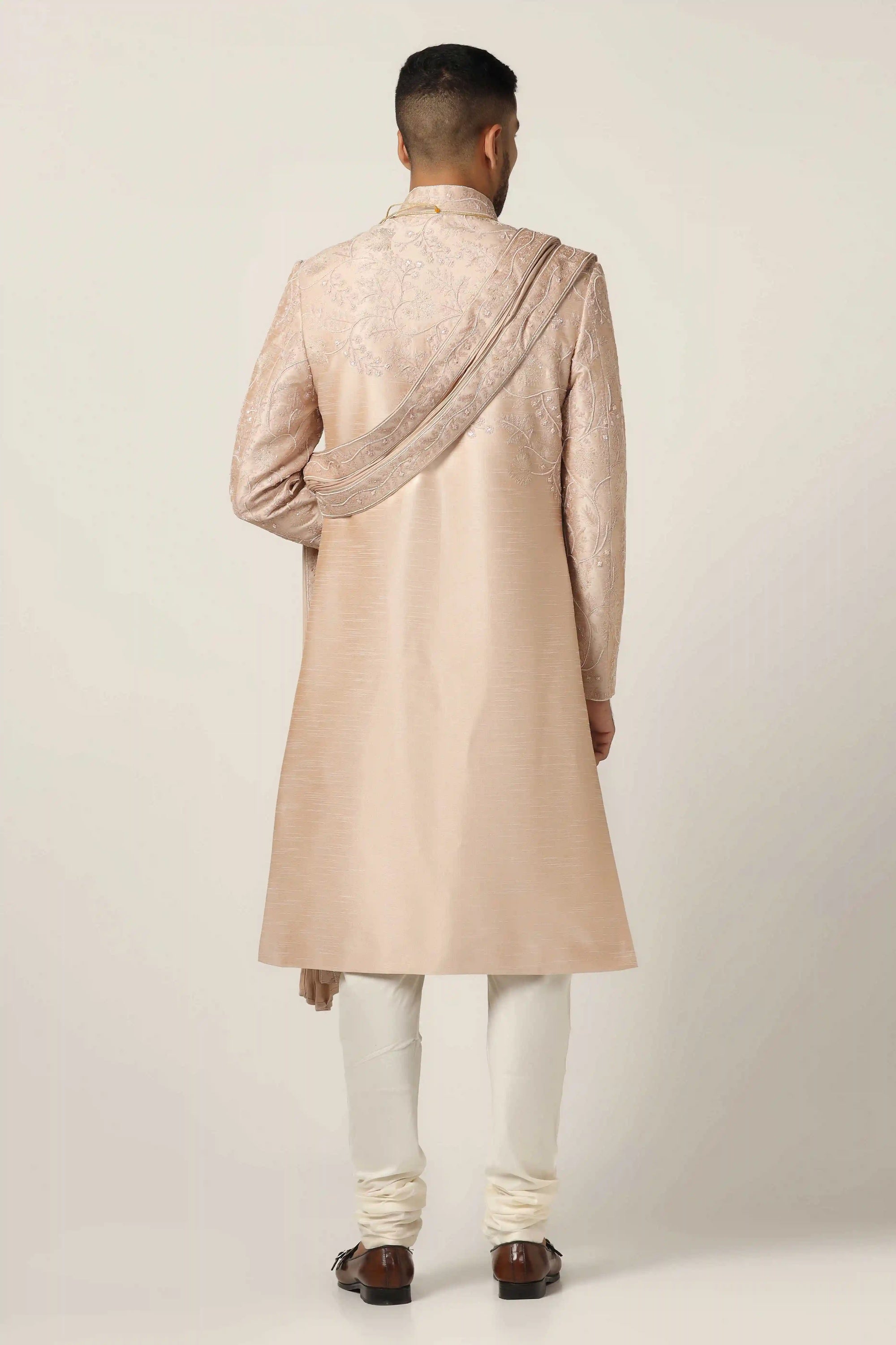 Elevate your style with Raw silk Sherwani set, adorned with intricate machine embroidery. Shop Now!