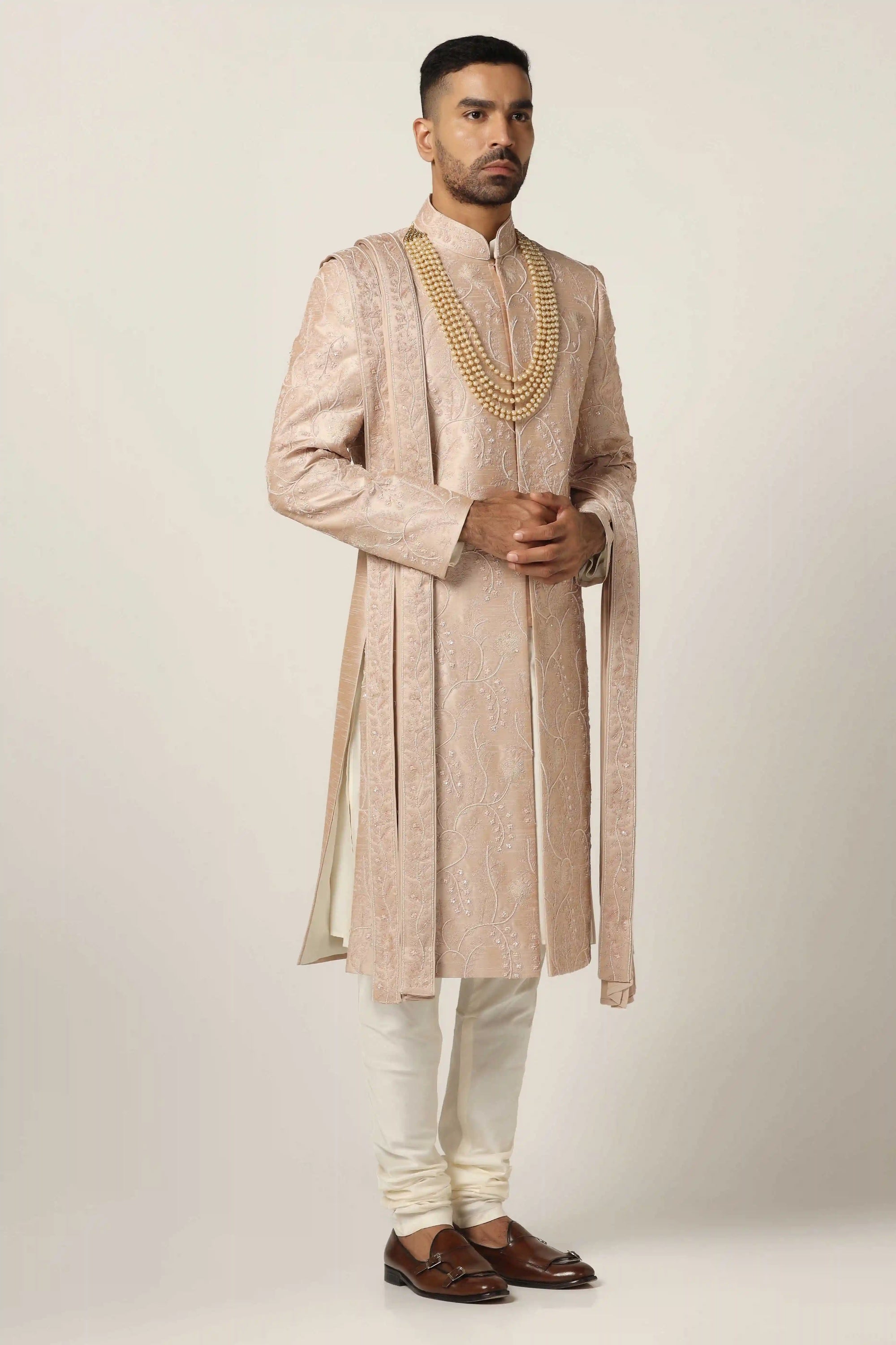 Elevate your style with Raw silk Sherwani set, adorned with intricate machine embroidery. Shop Now!