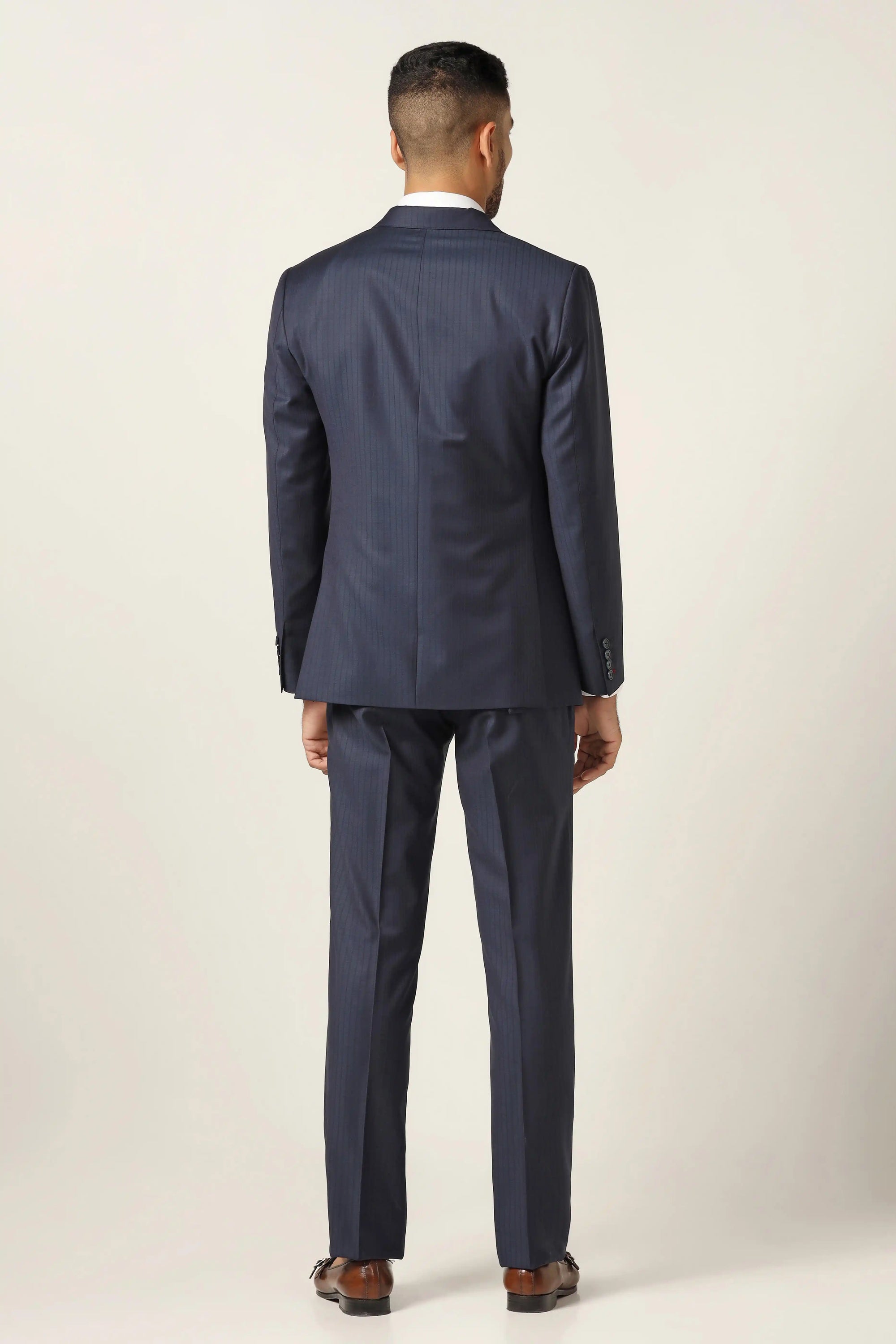 Make bold statement in our navy pinstripe suit. Shop Now!