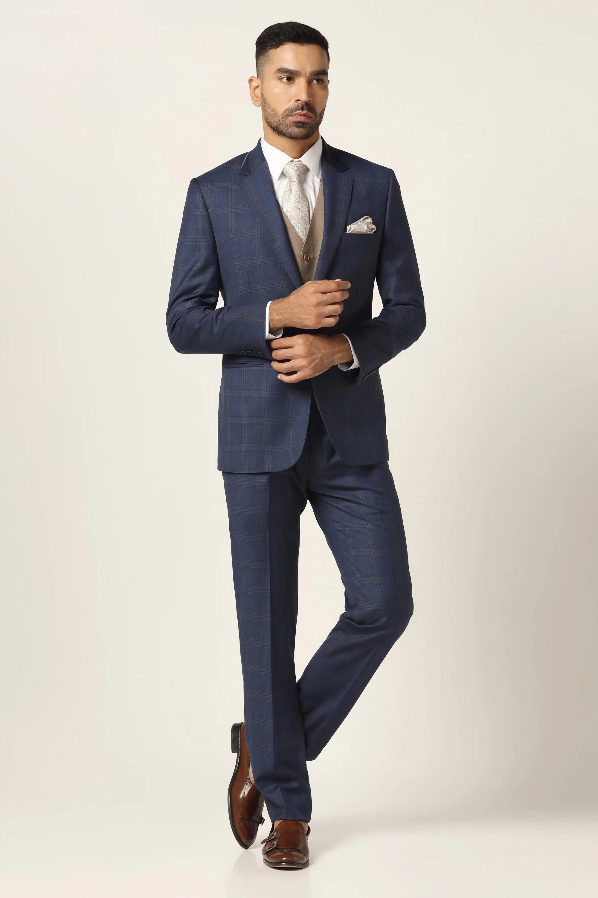Embrace refined style with our blue suit. Classic checked design for timeless elegance. Shop Now!