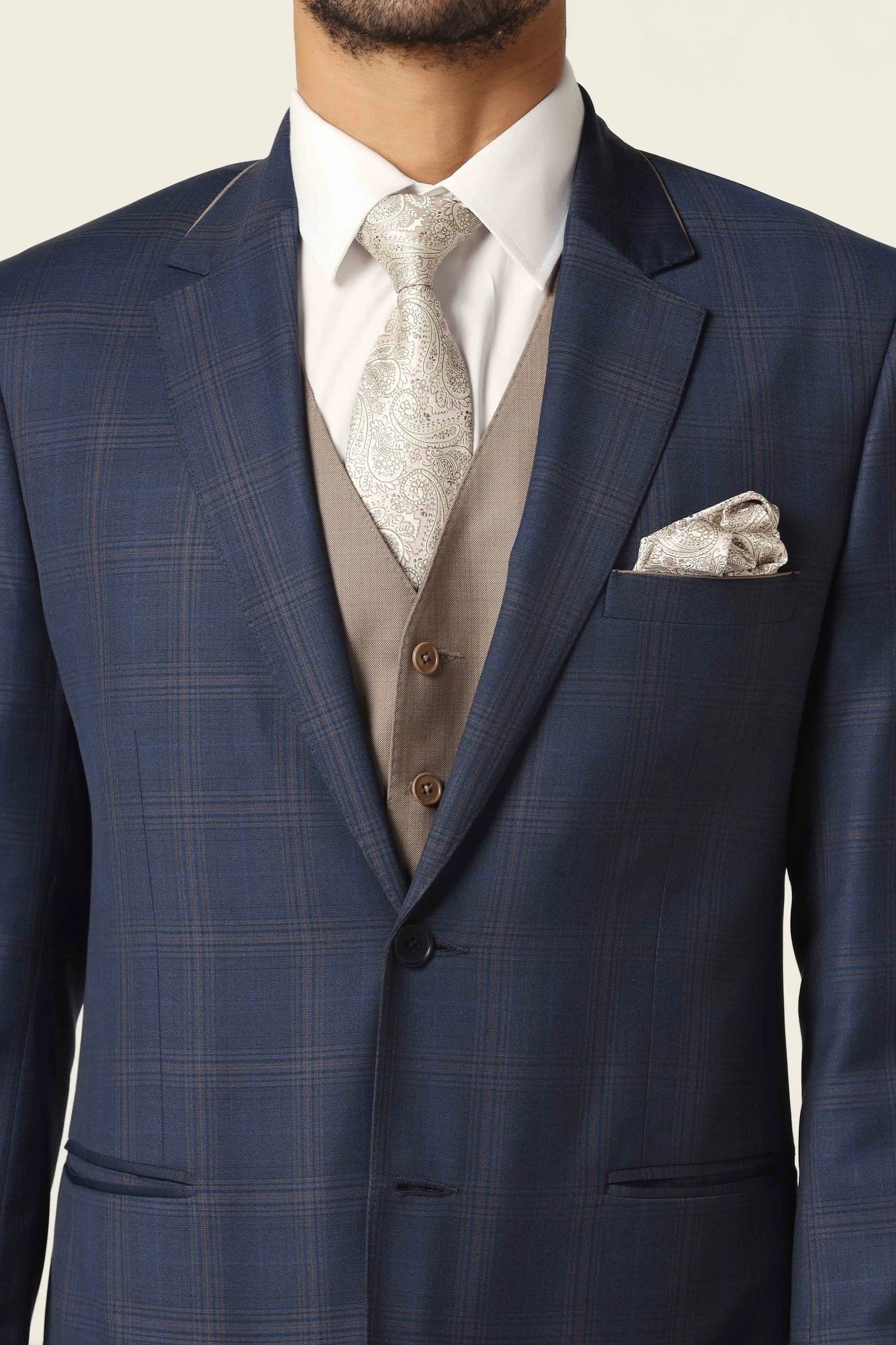 Embrace refined style with our blue suit. Classic checked design for timeless elegance. Shop Now!