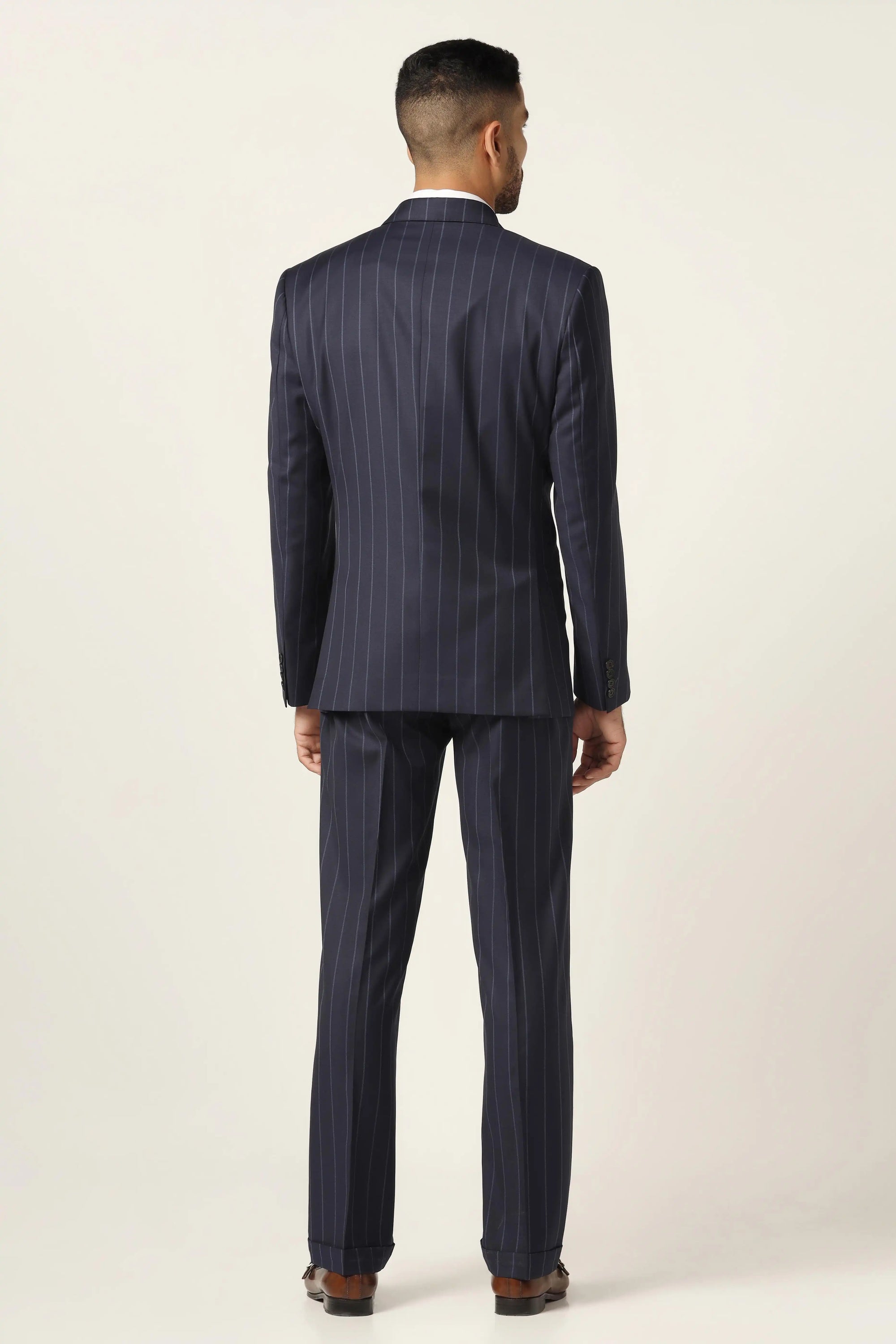 Redefine formalwear with this navy blue suit, featuring a sleek pinstripe pattern. Shop now!