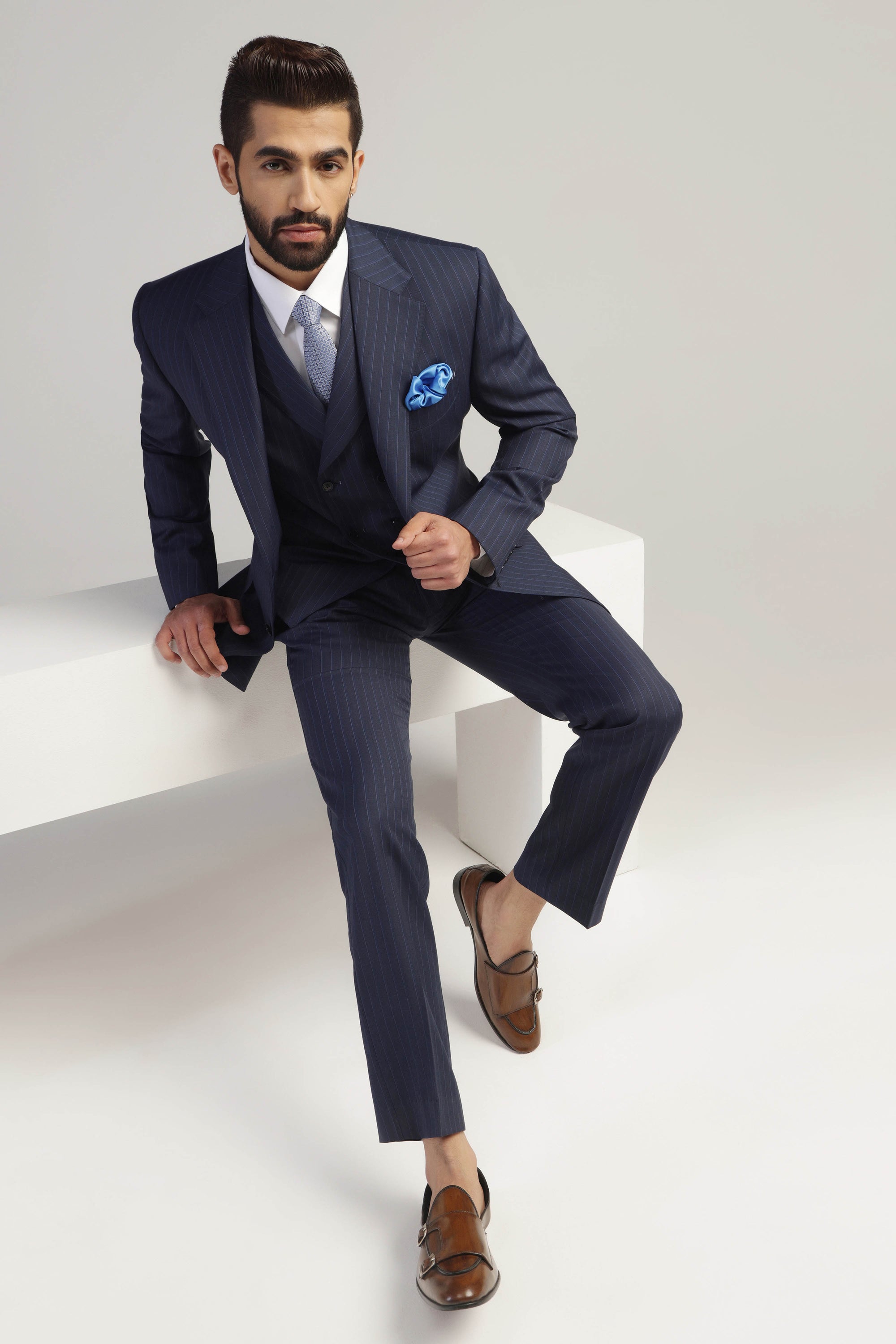 Upgrade your formal wardrobe with our Navy Pinstripe Suit. Shop Now!