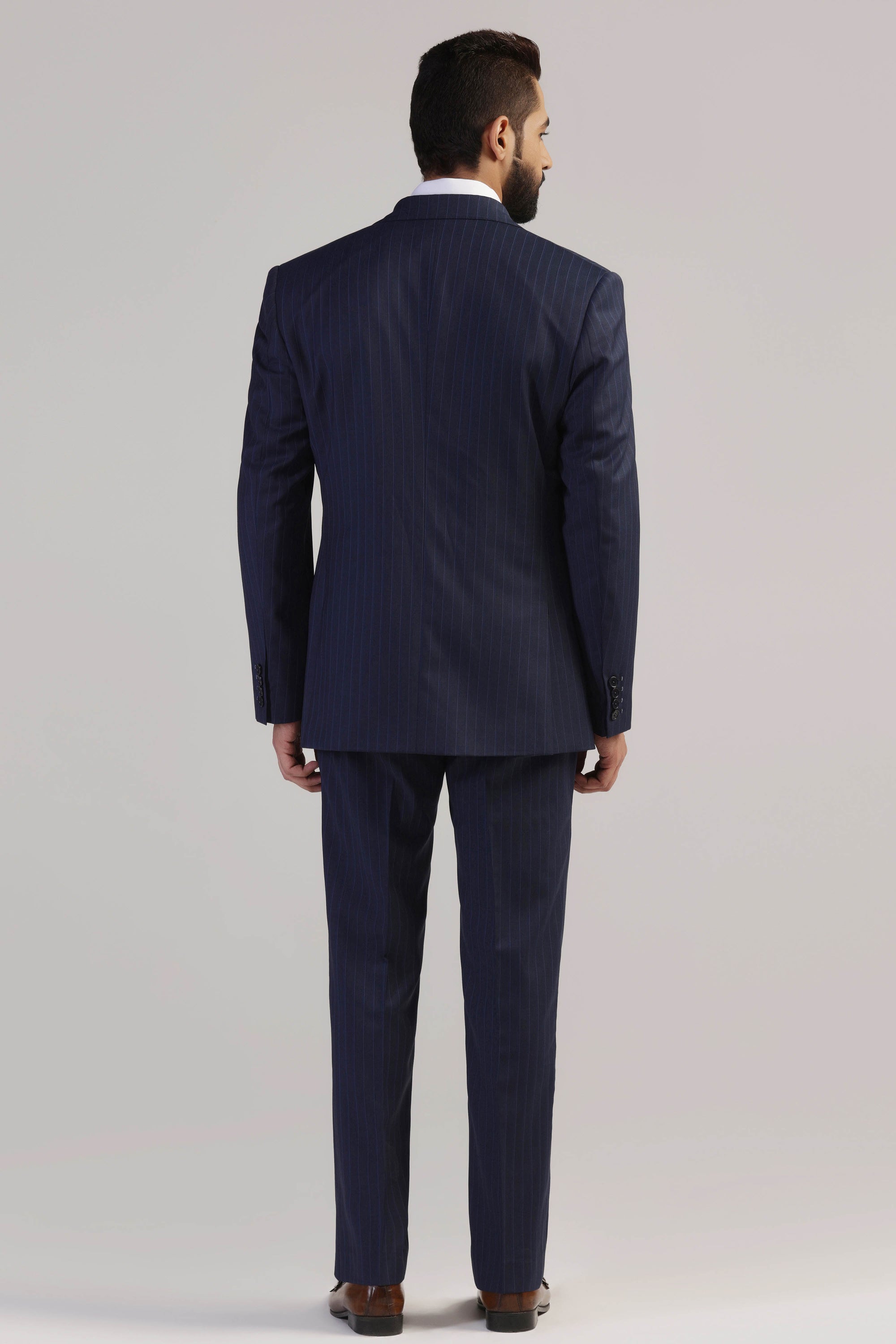 Upgrade your formal wardrobe with our Navy Pinstripe Suit. Shop Now!