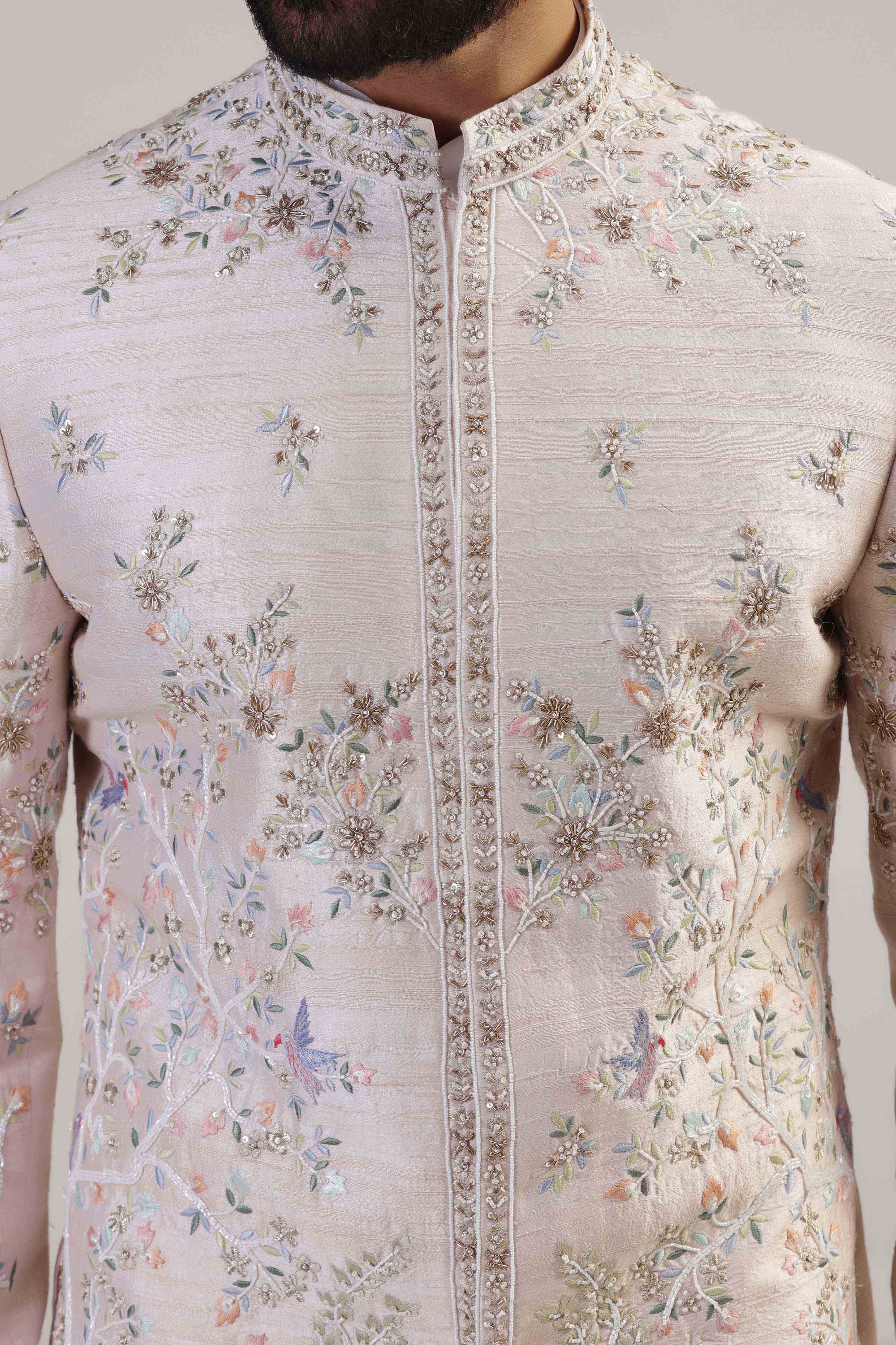 This Peach Embroidered Bandhgala suit is made with raw silk fabric. Shop Now!