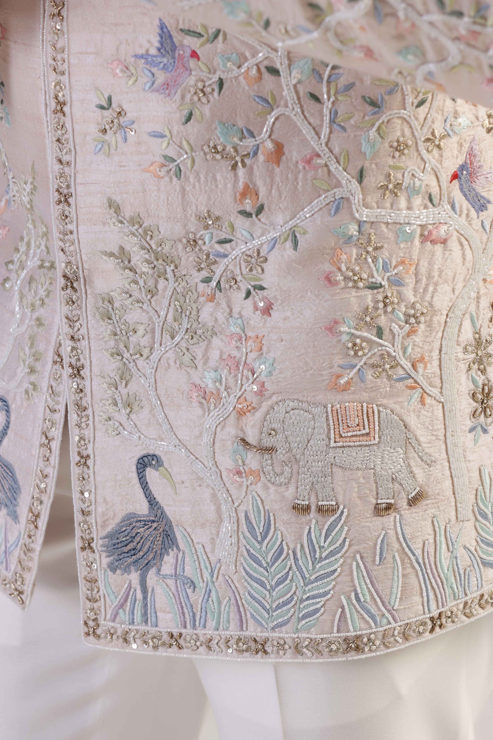 This Peach Embroidered Bandhgala suit is made with raw silk fabric. Shop Now!