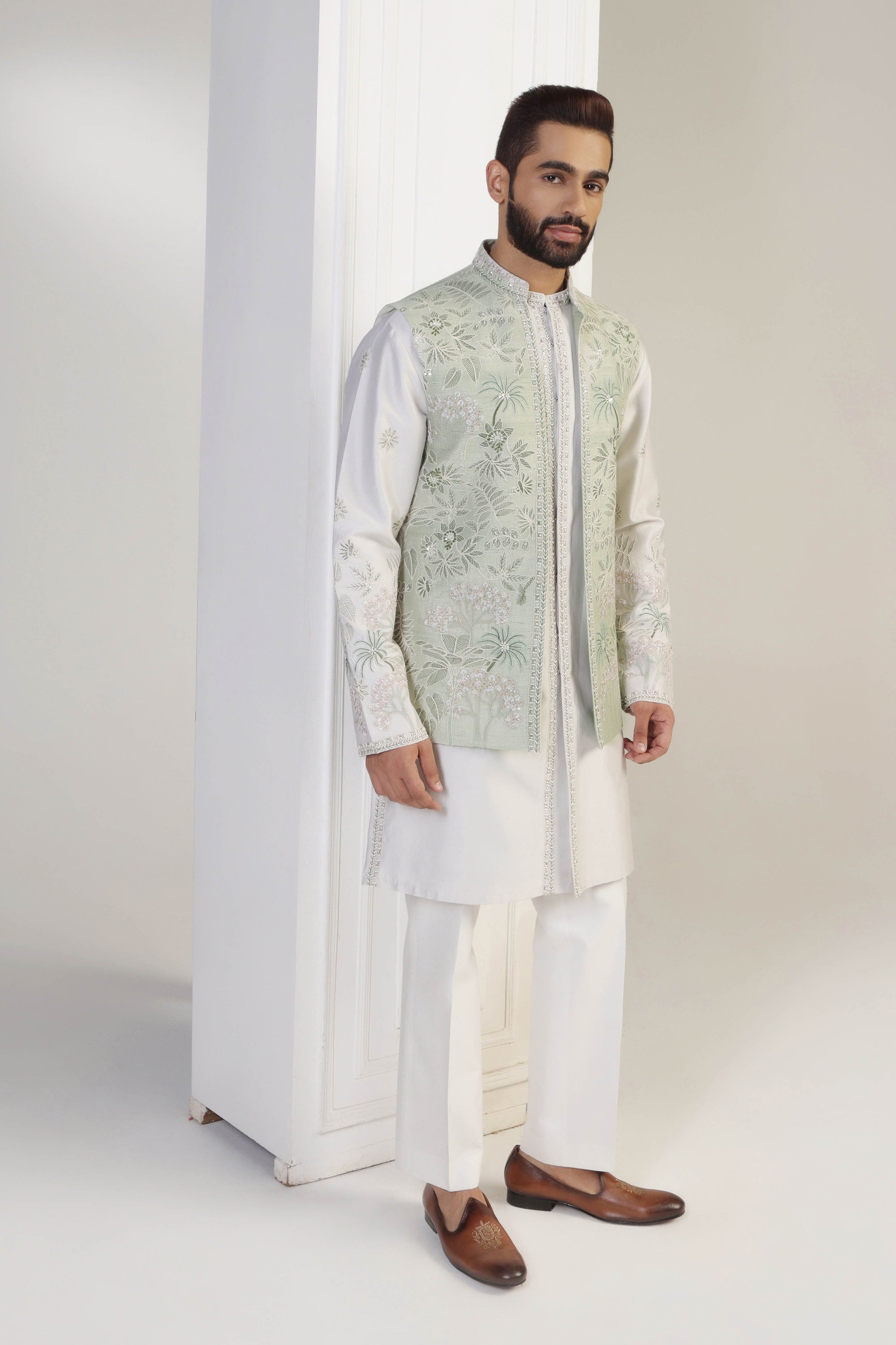 Crafted from silk fabric, this mint green jacket set exudes elegance and sophistication. Shop Now!