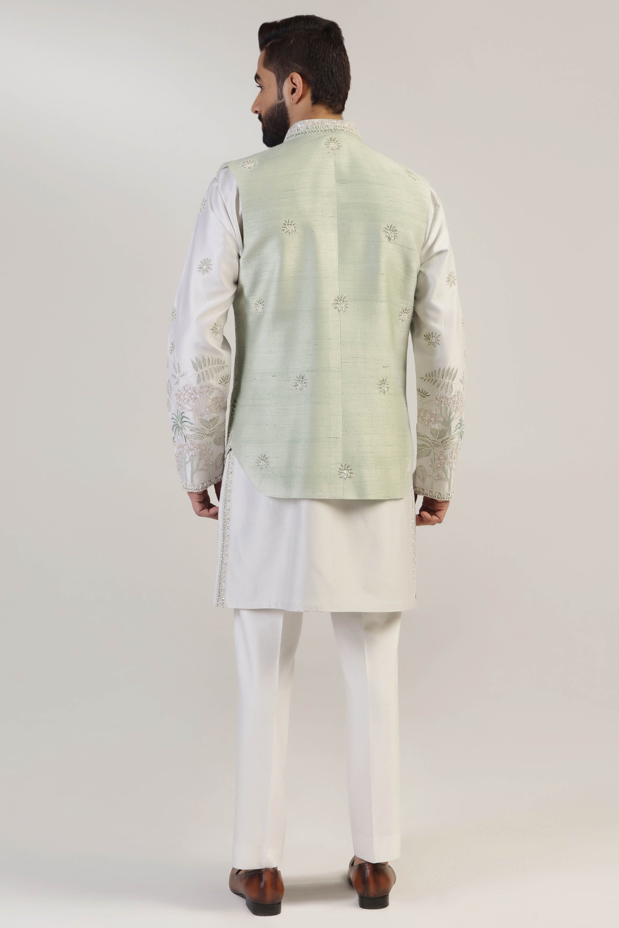 Crafted from silk fabric, this mint green jacket set exudes elegance and sophistication. Shop Now!