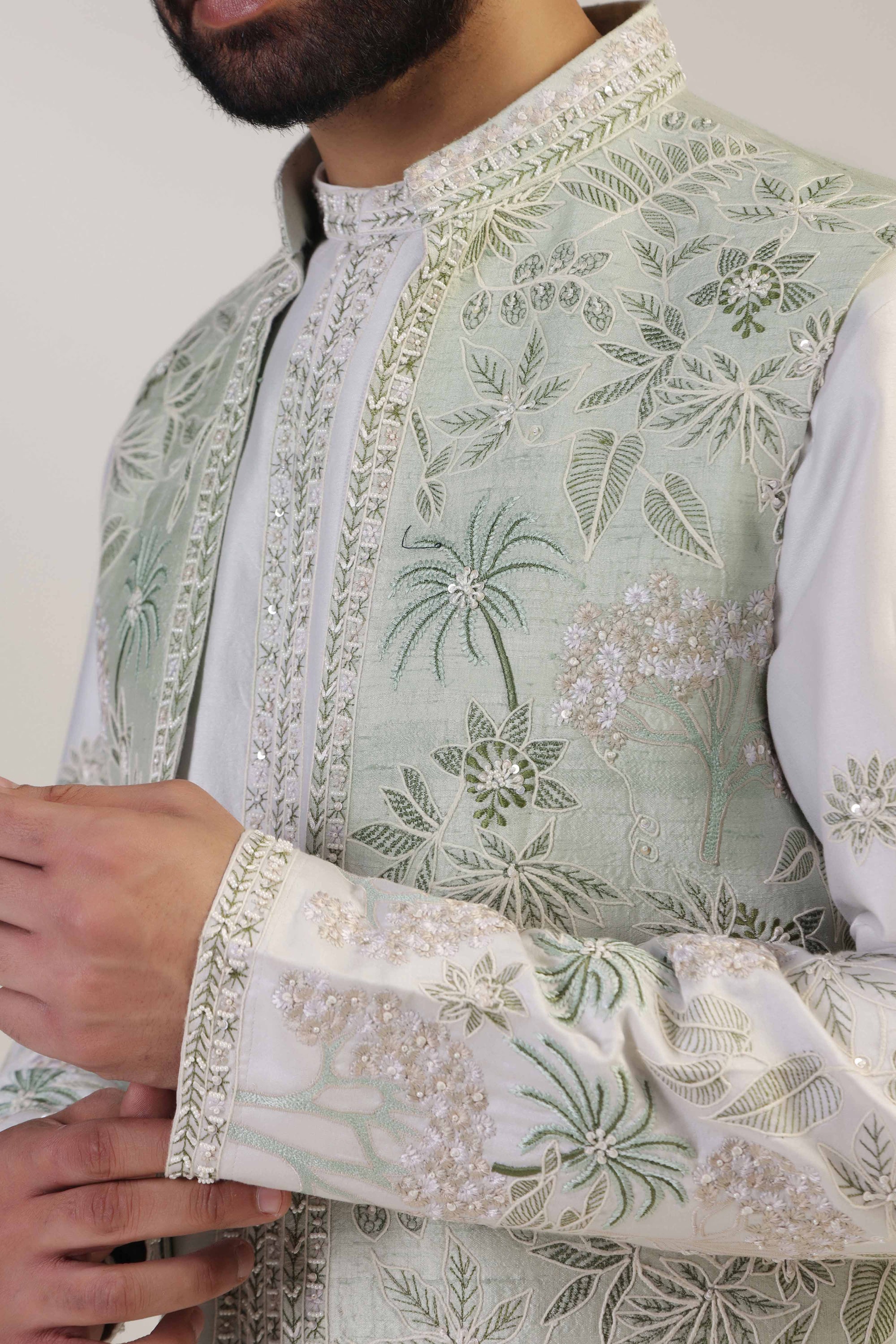 Crafted from silk fabric, this mint green jacket set exudes elegance and sophistication. Shop Now!