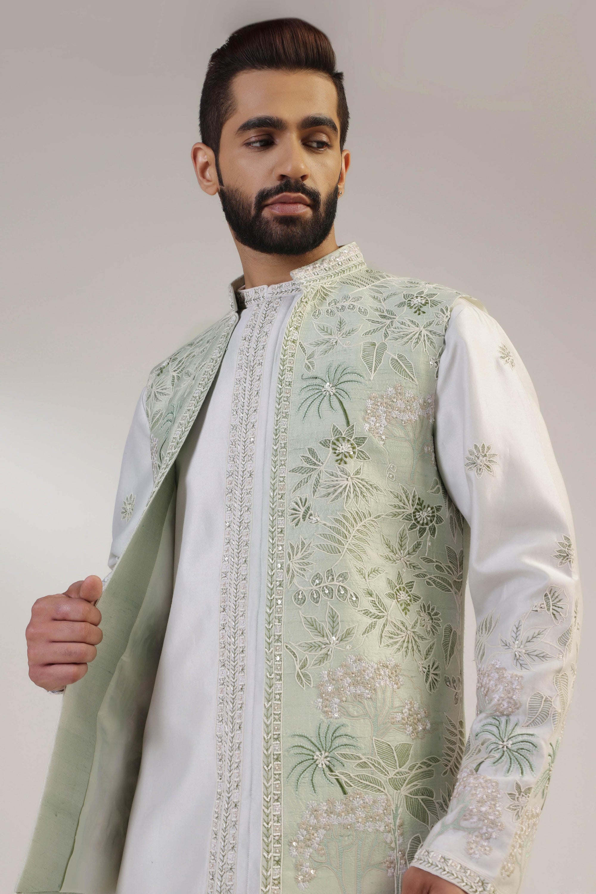 Crafted from silk fabric, this mint green jacket set exudes elegance and sophistication. Shop Now!