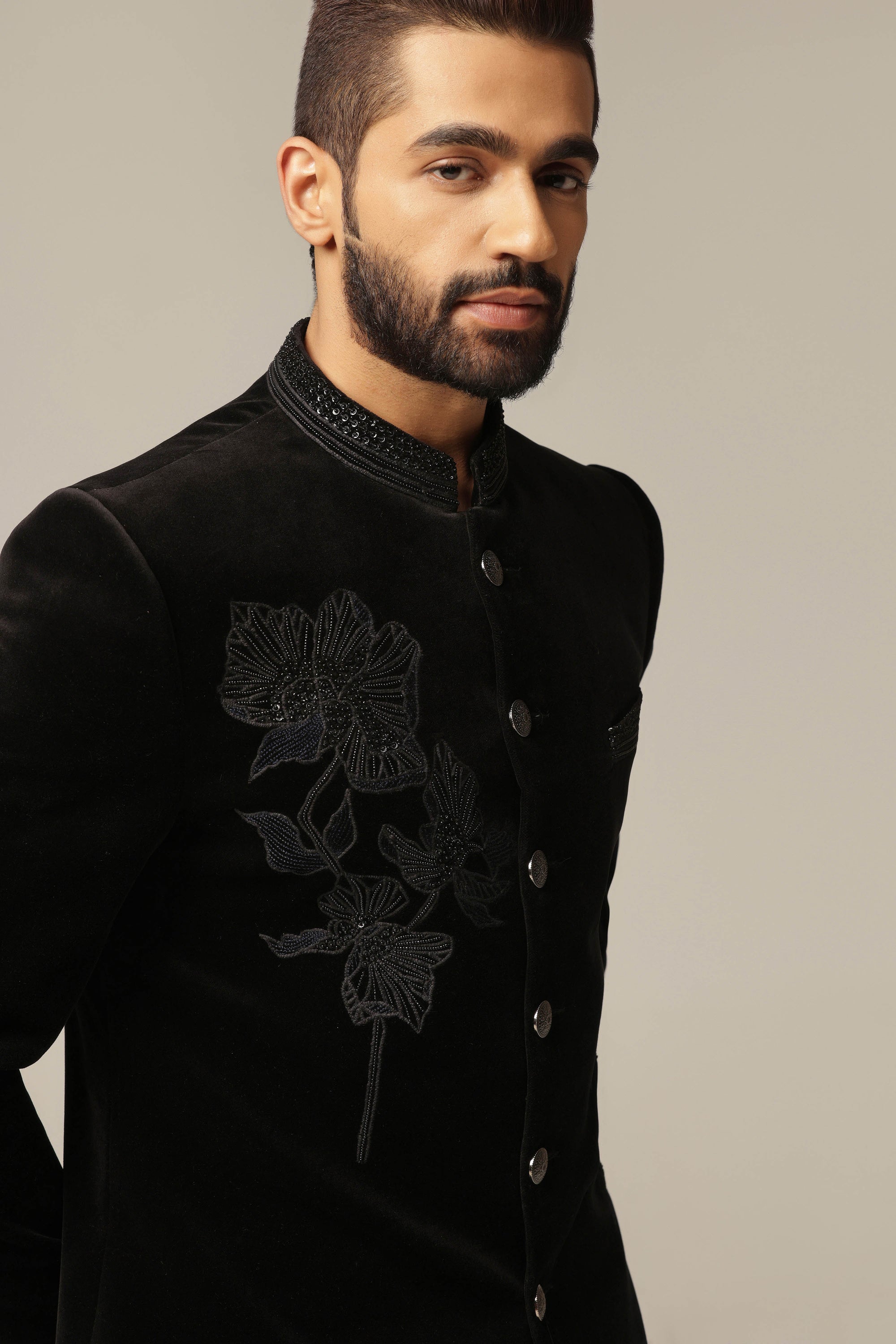 This Black Velvet Bandhgala Suit is made with soft and luxurious cotton velvet fabric. Shop Now!
