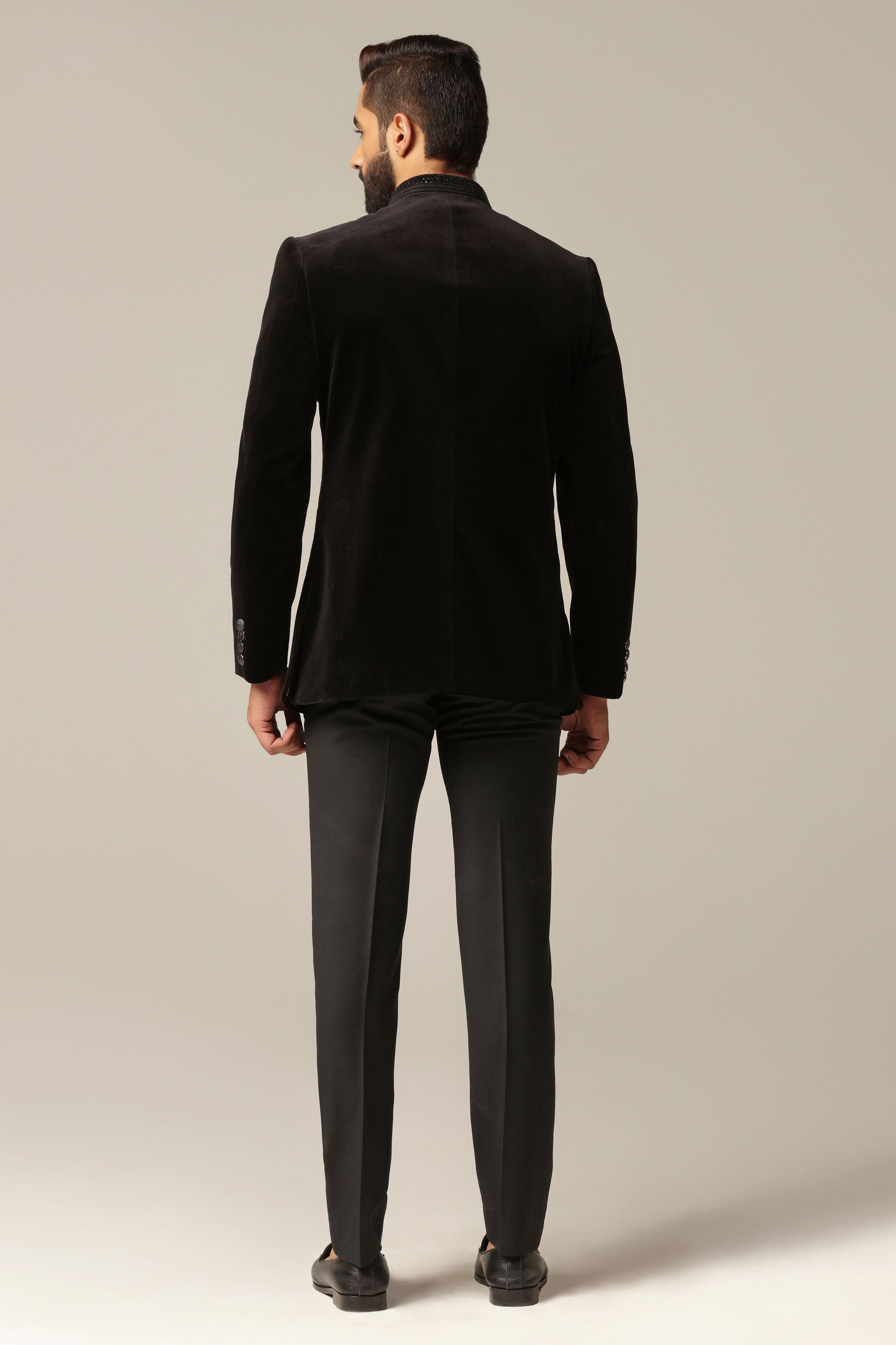 This Black Velvet Bandhgala Suit is made with soft and luxurious cotton velvet fabric. Shop Now!