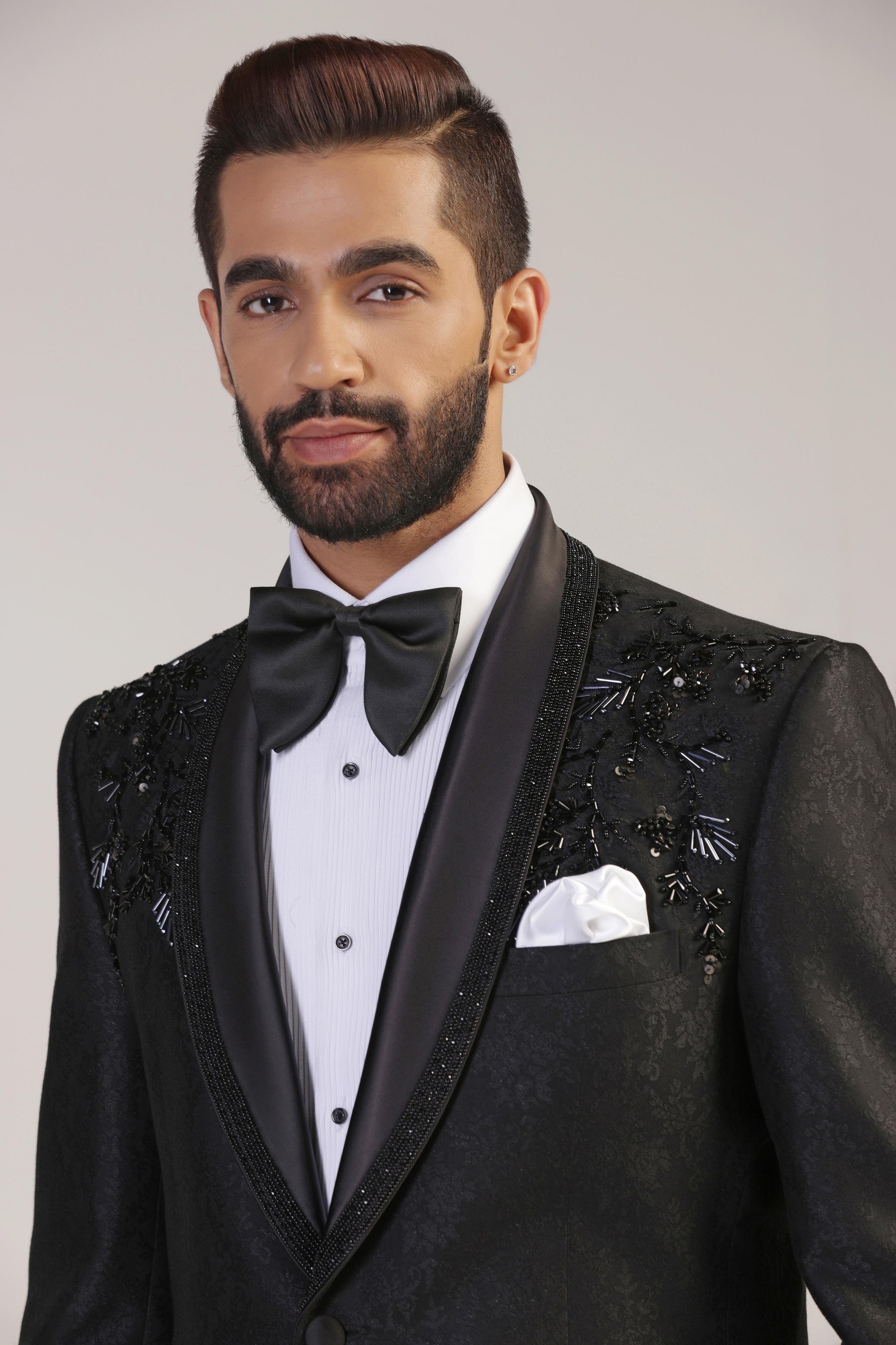 The Black Jacquard Tuxedo boasts a shawl collar with embroidery. Shop Now!