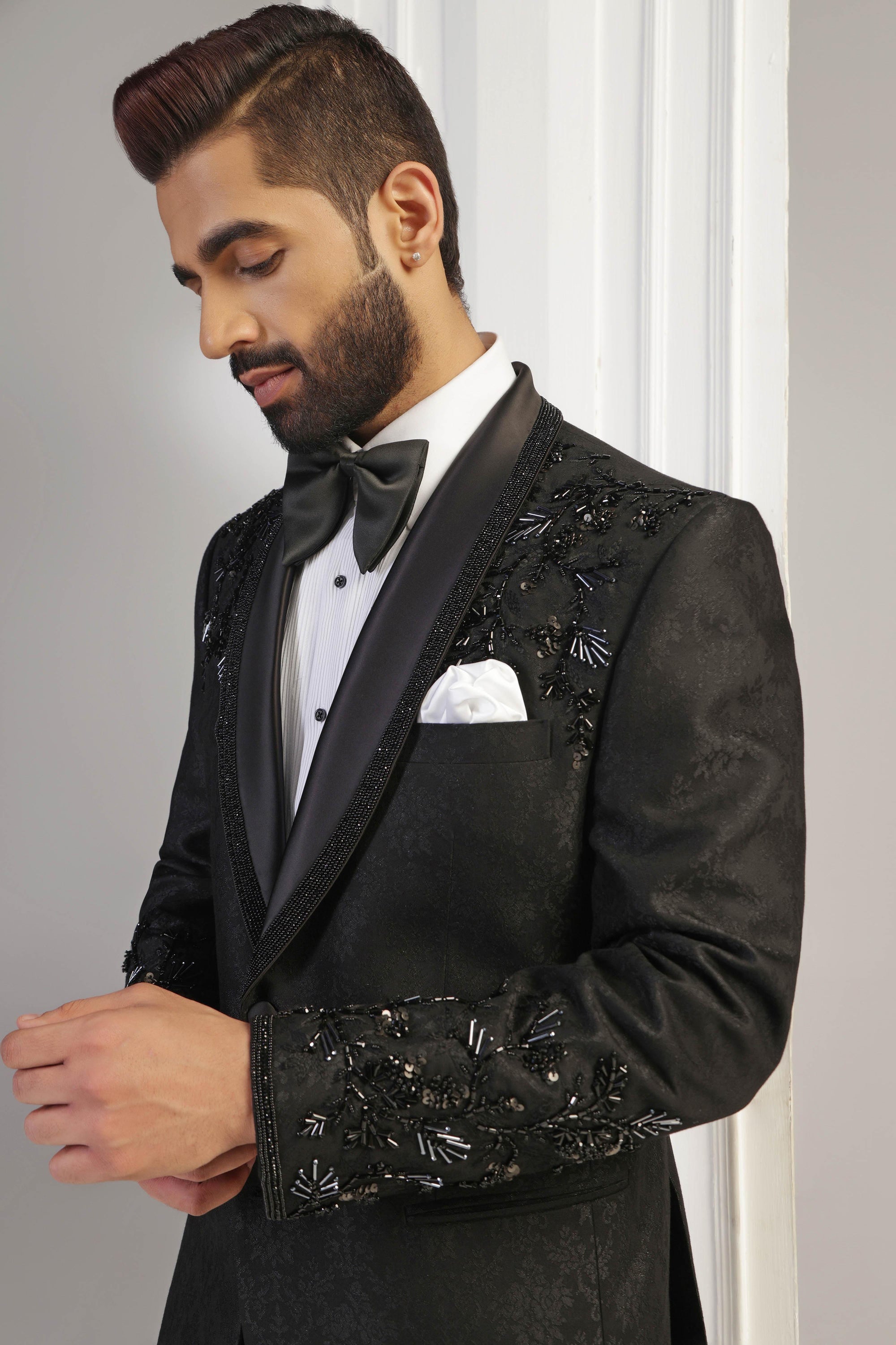 The Black Jacquard Tuxedo boasts a shawl collar with embroidery. Shop Now!