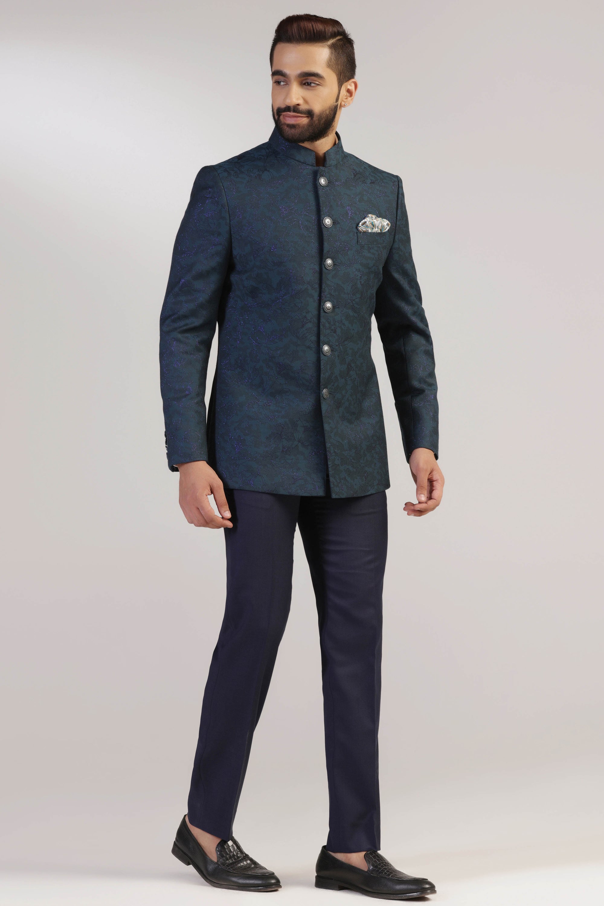 Crafted in Italian fine wool , this Teal Bandhgala suit exudes sophistication and style. Shop Now!