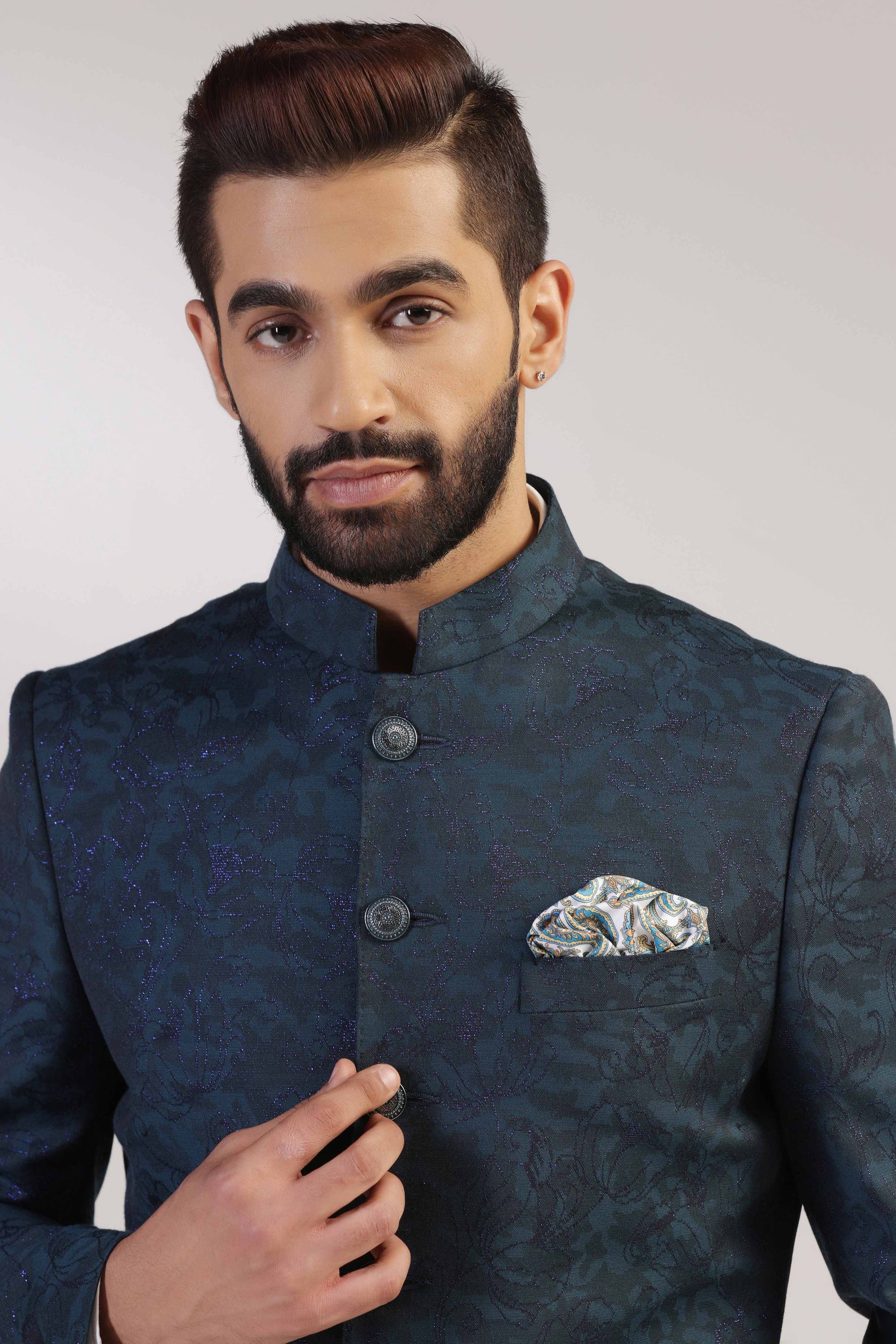 Crafted in Italian fine wool , this Teal Bandhgala suit exudes sophistication and style. Shop Now!