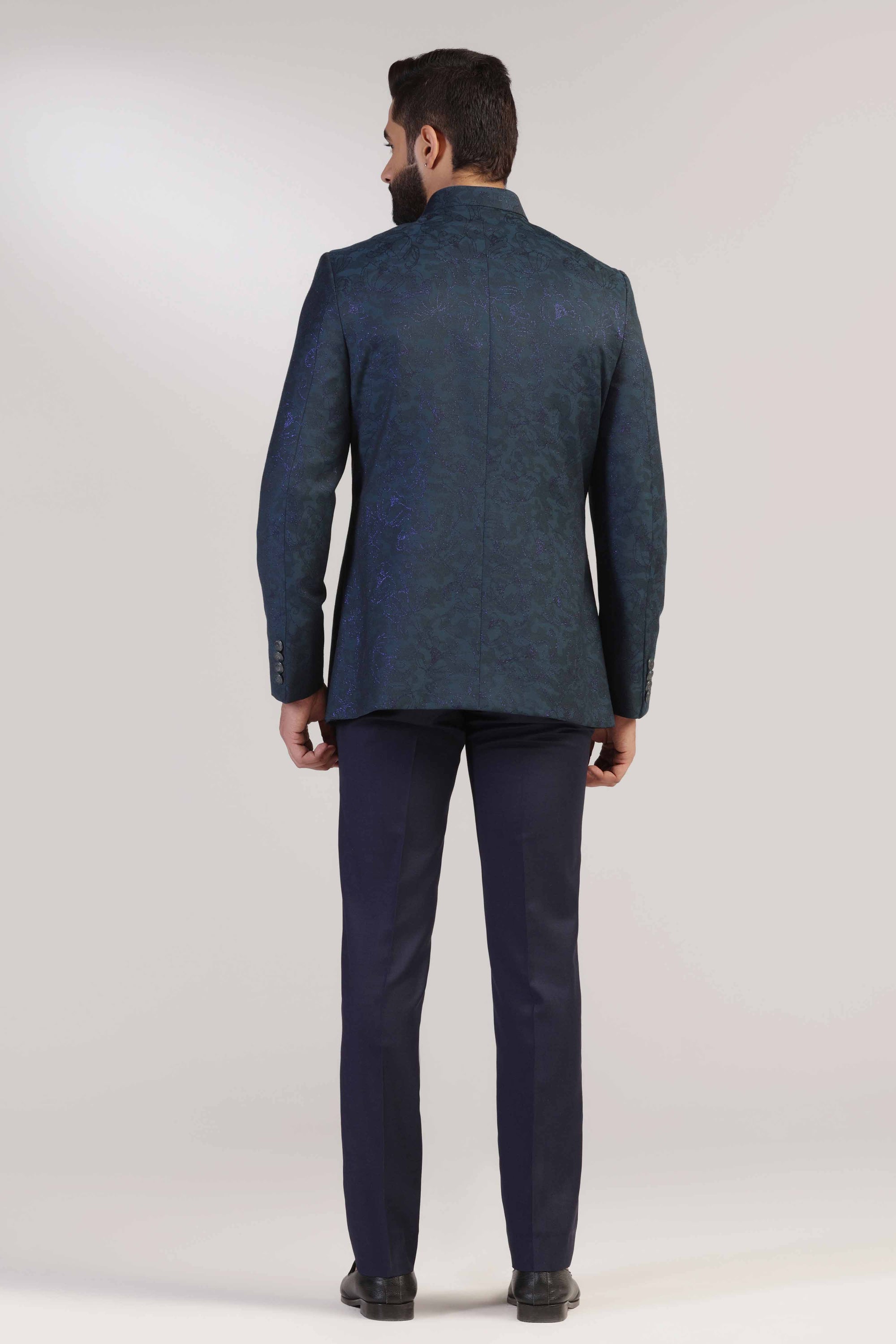Crafted in Italian fine wool , this Teal Bandhgala suit exudes sophistication and style. Shop Now!