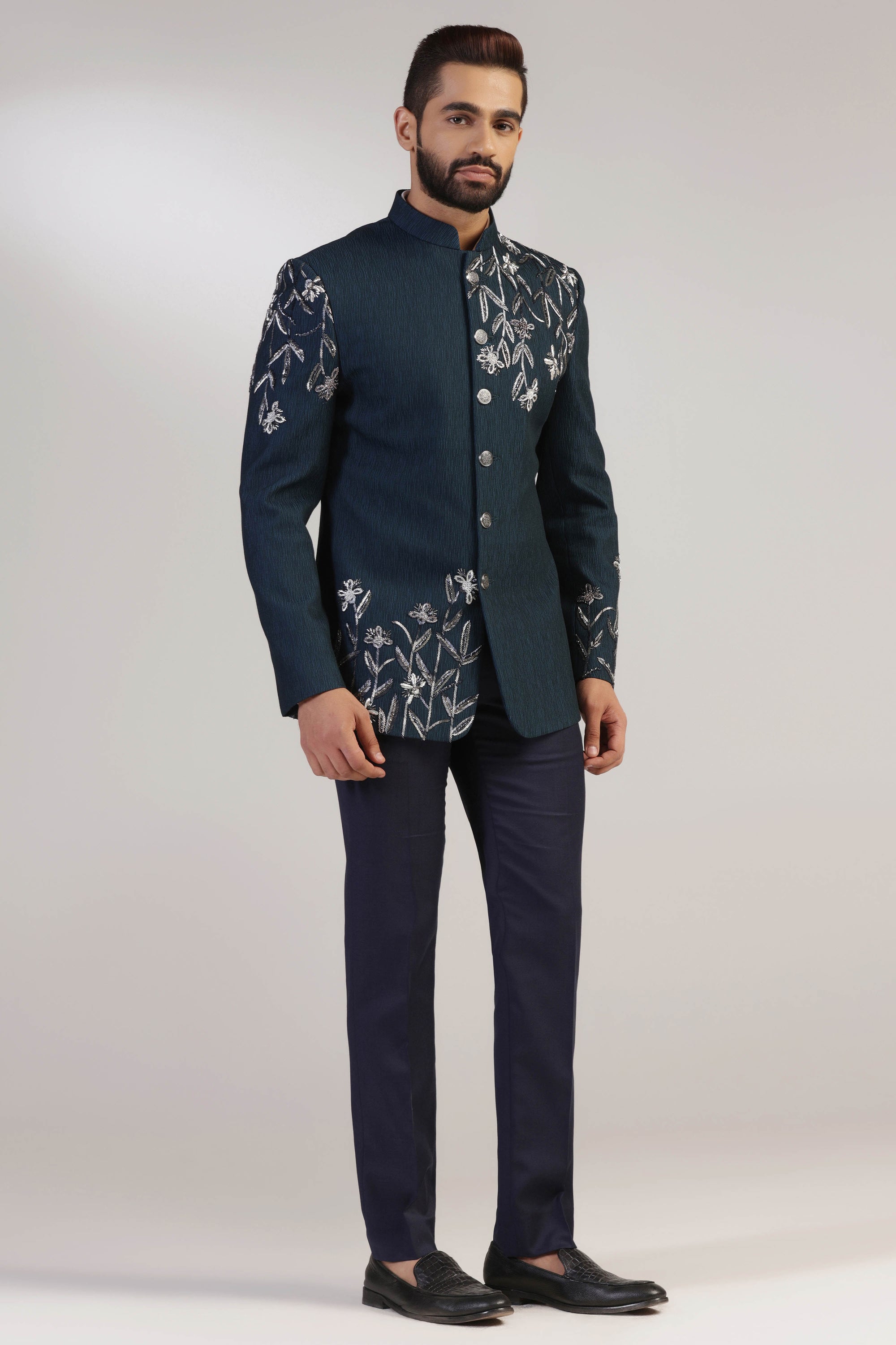 Crafted from wool fabric, this Green Bandhgala suit exudes elegance and sophistication. Shop Now!