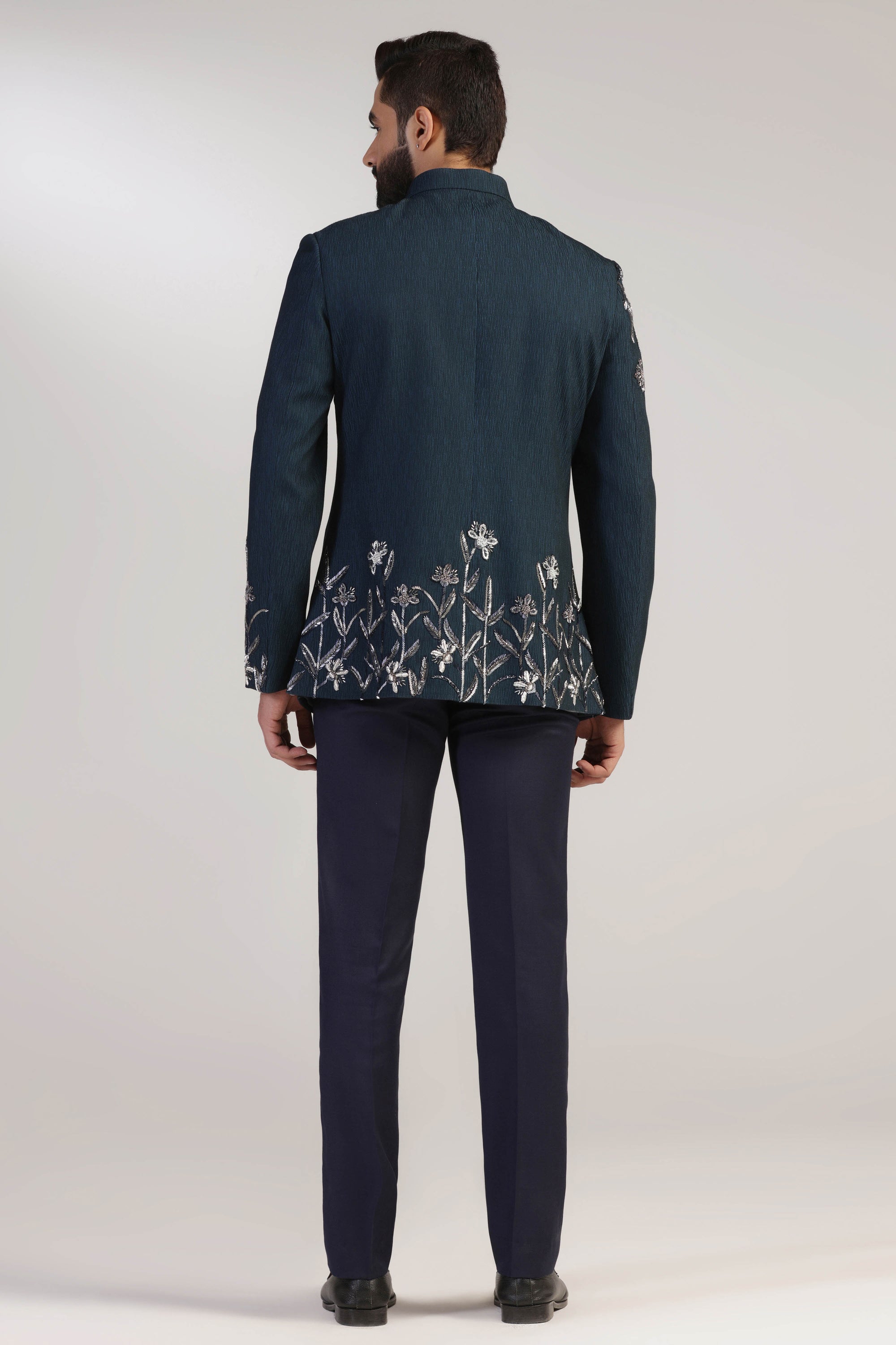 Crafted from wool fabric, this Green Bandhgala suit exudes elegance and sophistication. Shop Now!