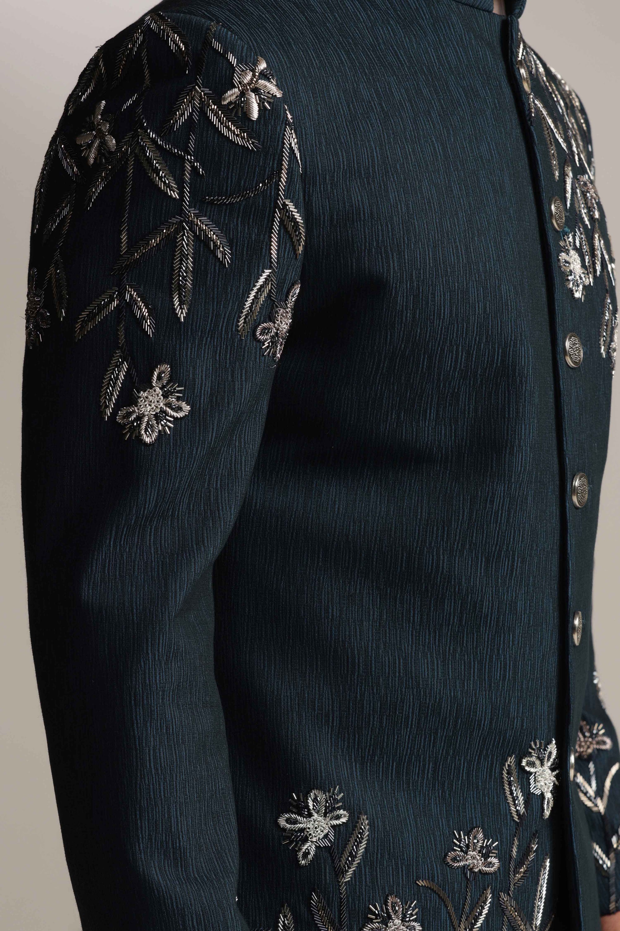 Crafted from wool fabric, this Green Bandhgala suit exudes elegance and sophistication. Shop Now!