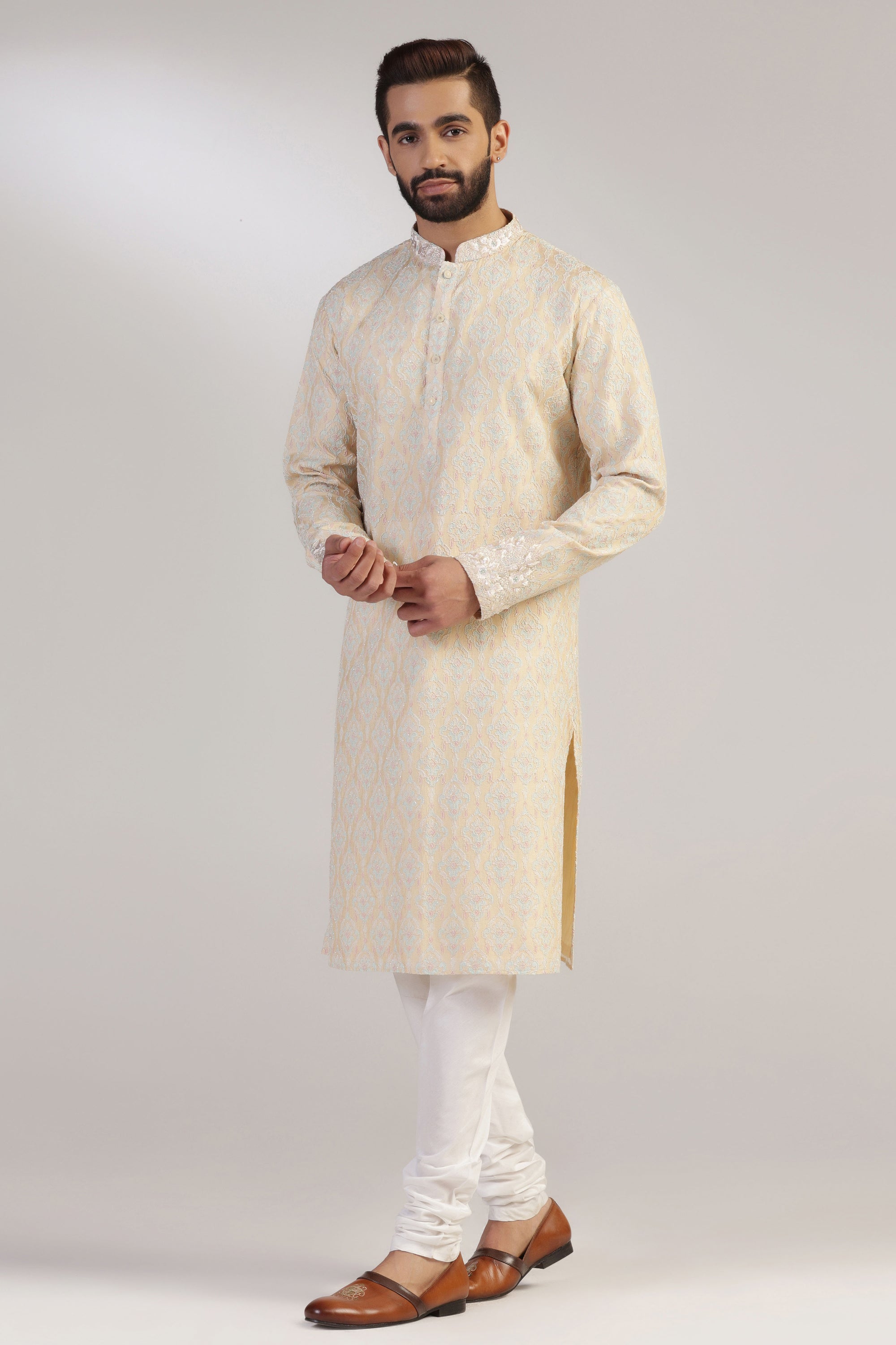 This Yellow Multicolour Kurta Pajama is made from luxurious silk fabric. Shop Now!