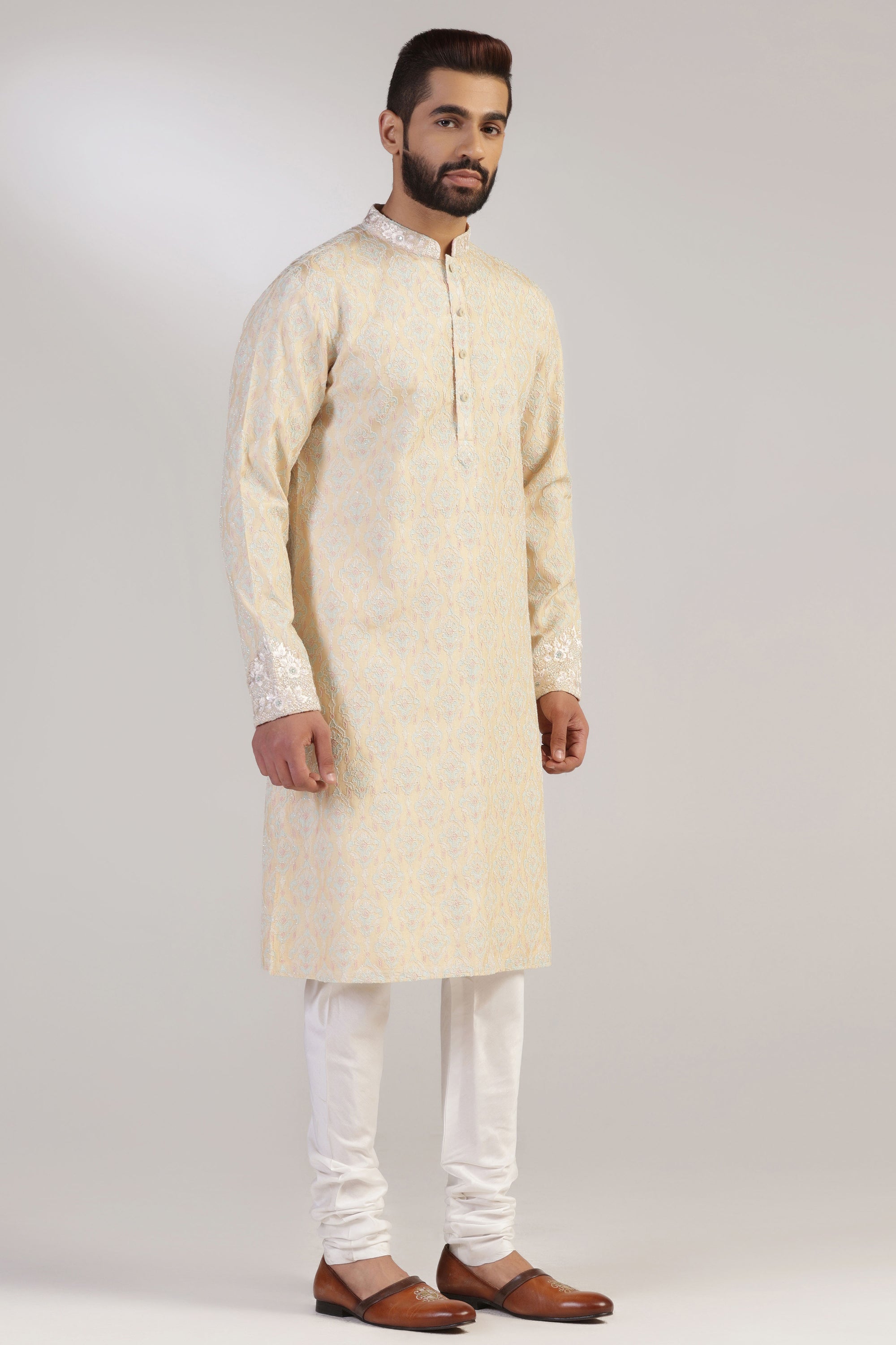 This Yellow Multicolour Kurta Pajama is made from luxurious silk fabric. Shop Now!